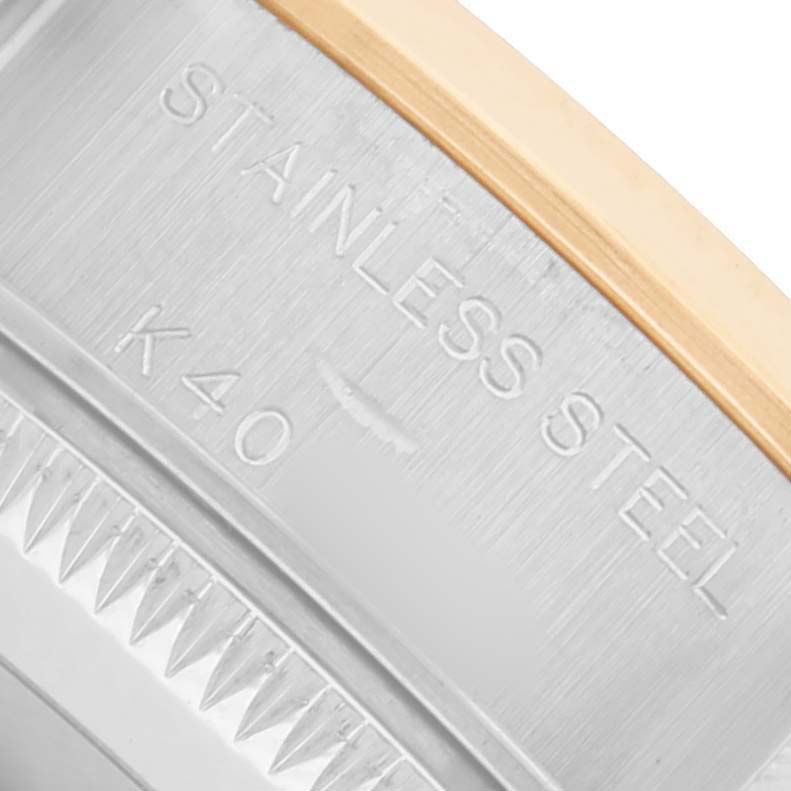 The image shows a close-up of the stainless steel back and edge of a Rolex Datejust 79163 Women's Steel and Gold (two tone) Grey Dial watch.