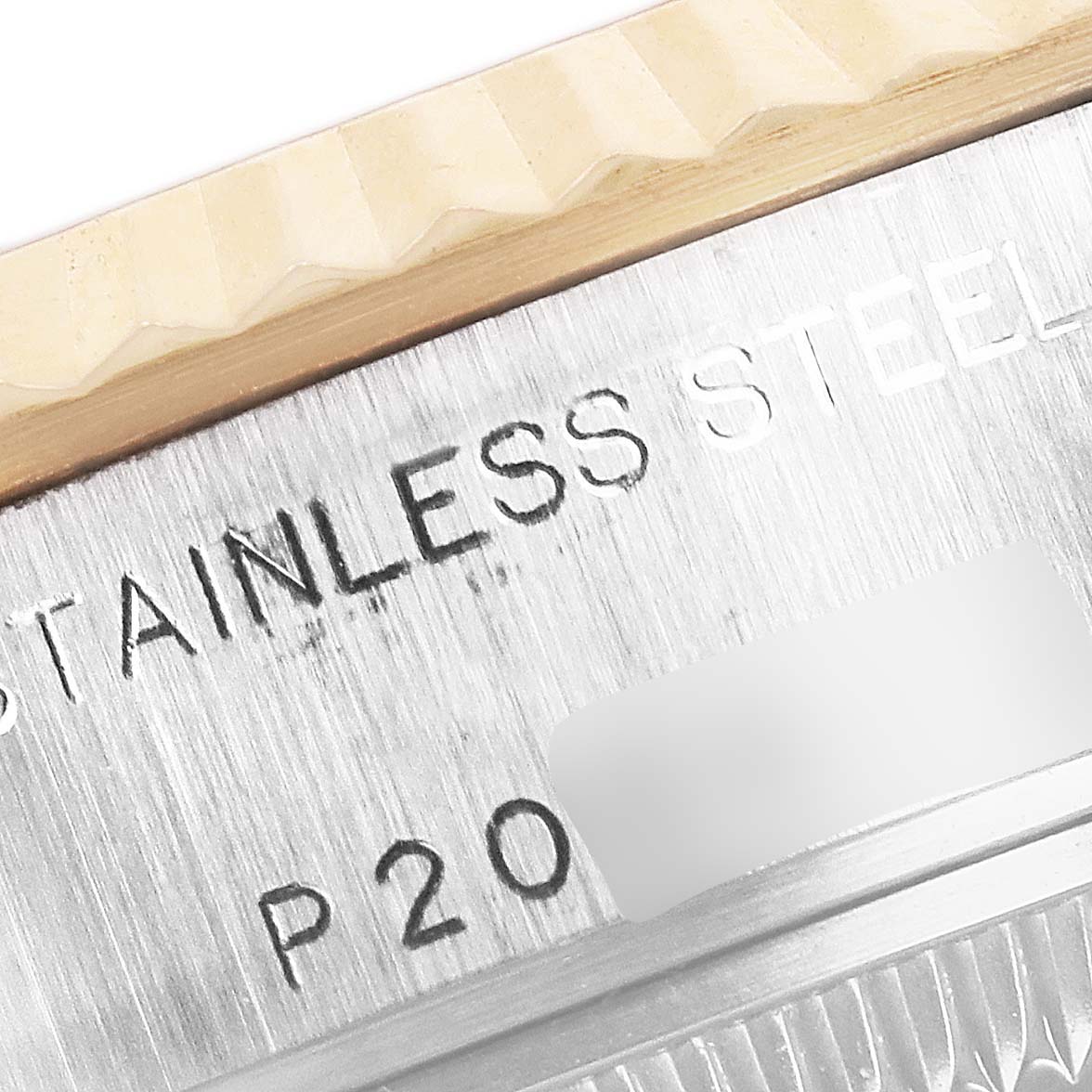 The image shows a close-up of the stainless steel case and part of the bezel of a Rolex Datejust 79173 Women's Steel and Gold (two tone) White Dial 79173 Women's Steel and Gold (two tone) White Dial watch.