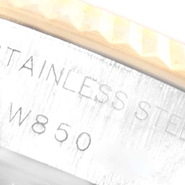 This image shows a close-up of the engraved side of the bezel and case of a Rolex Datejust 69173 Women
s Steel and Gold (two tone) Champagne Dial 69173 Women
s Steel and Gold (two tone) Champagne Dial watch.