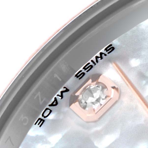 This Rolex Mid-Size 178341 Women's Steel and Gold (two tone) Mother of Pearl Dial 178341 Women's Steel and Gold (two tone) Mother of Pearl Dial watch image shows a close-up of the dial with part of a gemstone marker and "SWISS MADE" text.