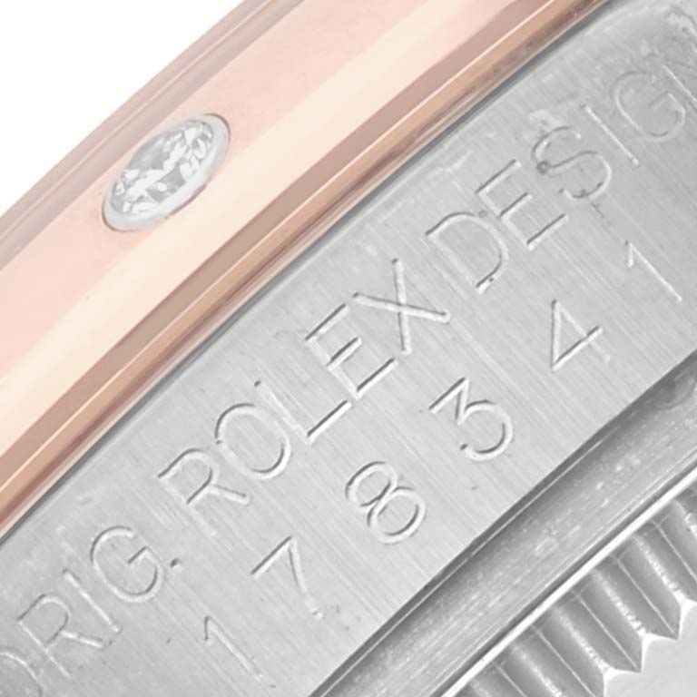 The image shows a close-up of a *Rolex Mid-Size 178341 Women's Steel and Gold (two tone) Mother of Pearl Dial 178341 Women's Steel and Gold (two tone) Mother of Pearl Dial* watch, focusing on the engraved side and part of the bezel.