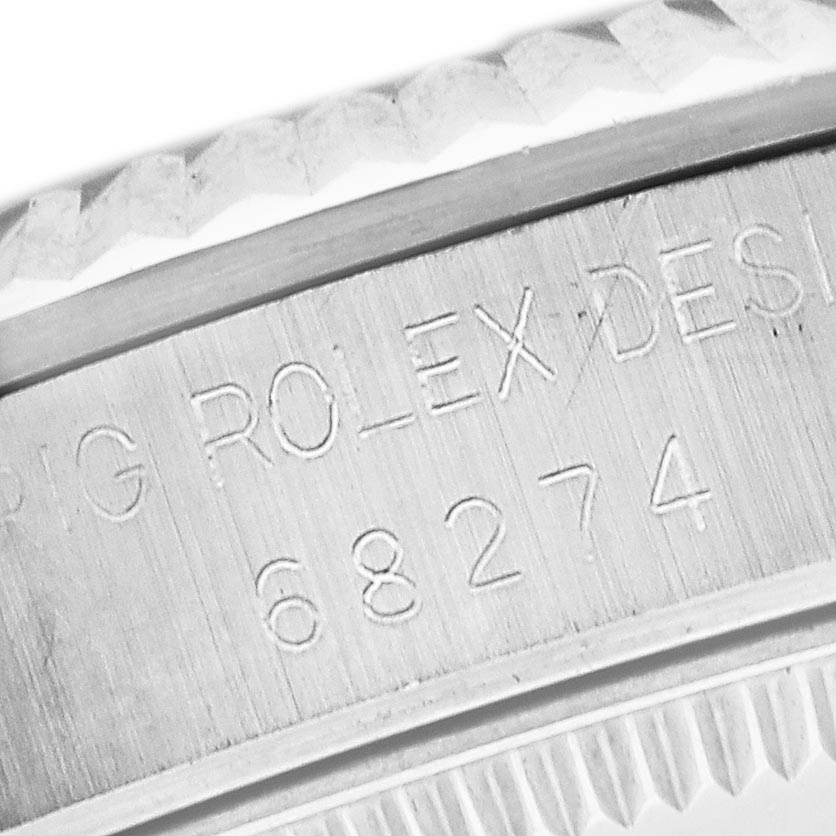 The image shows the serial number engraving on the side of a Rolex Mid-Size 68274 Women's Stainless Steel Silver Dial 68274 Women's Stainless Steel Silver Dial model.