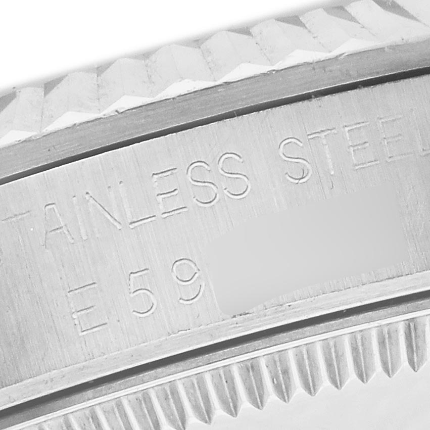 The image shows a close-up of the model and serial engraving on the stainless steel case of a Rolex Mid-Size 68274 Women's Stainless Steel Silver Dial 68274 Women's Stainless Steel Silver Dial watch.