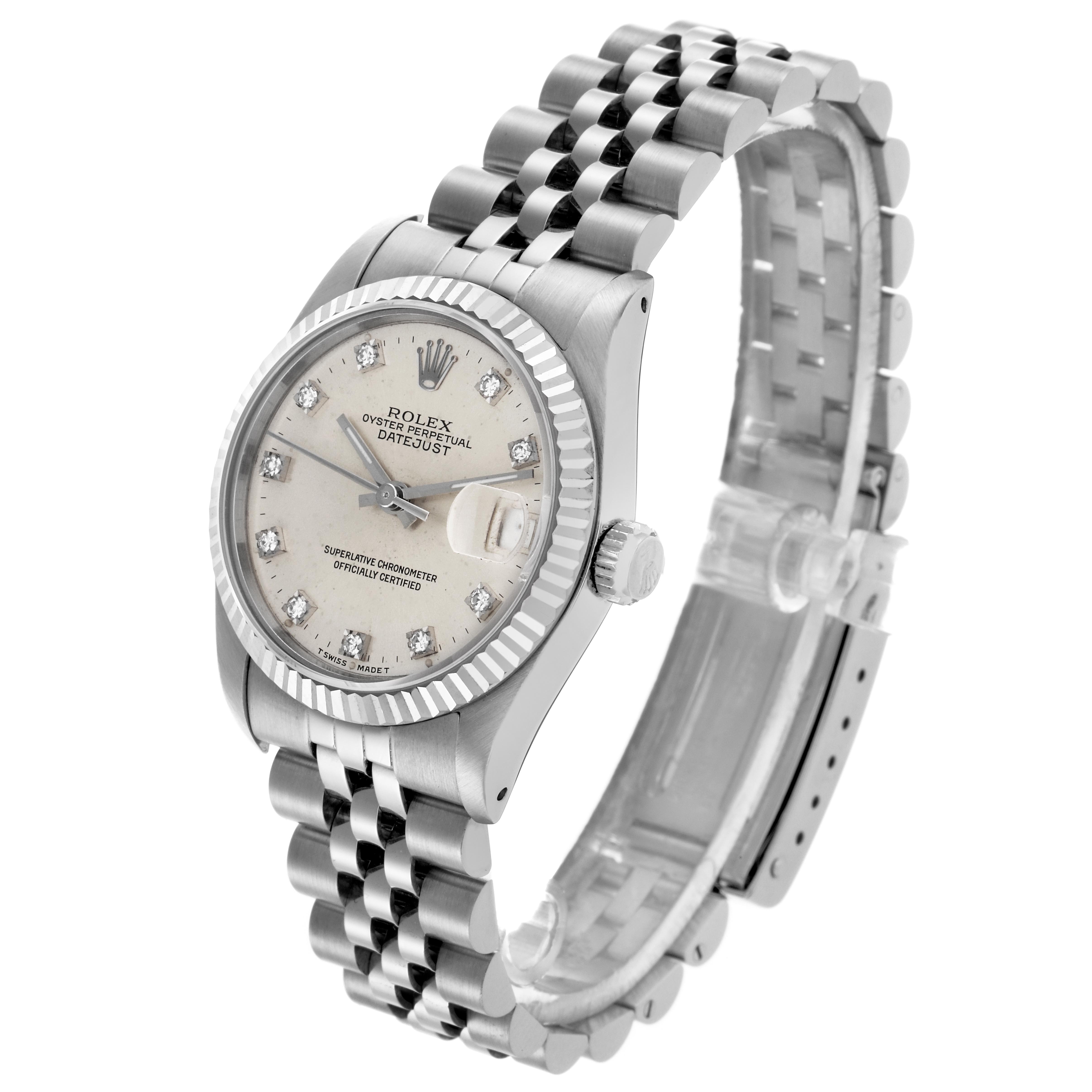 The Rolex Mid-Size 68274 Women's Stainless Steel Silver Dial 68274 Women's Stainless Steel Silver Dial Datejust watch is shown at a three-quarter angle, displaying the dial, bracelet, crown, and clasp.