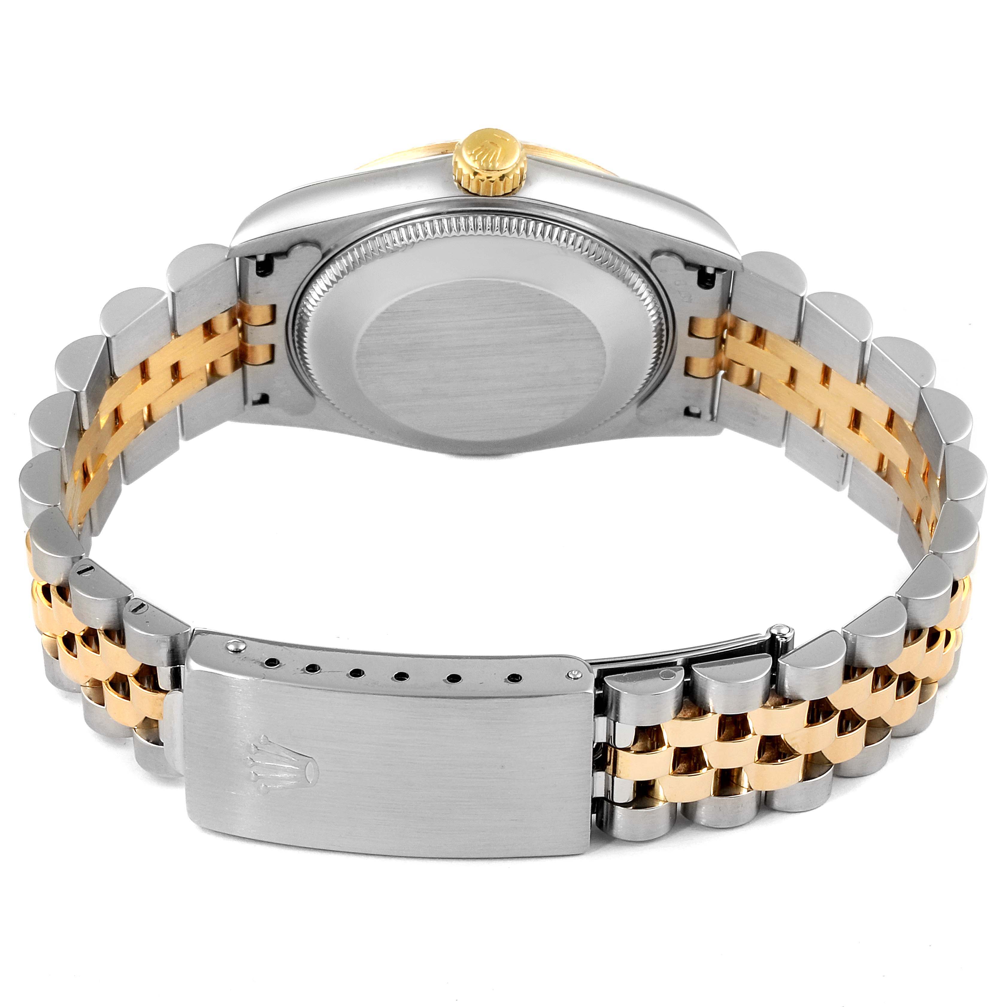 The image shows the Rolex Mid-Size 68273 Women
s Steel and Gold (two tone) White Dial 68273 Women
s Steel and Gold (two tone) White Dial model from the rear, highlighting the screw-down case back, bracelet, and clasp.