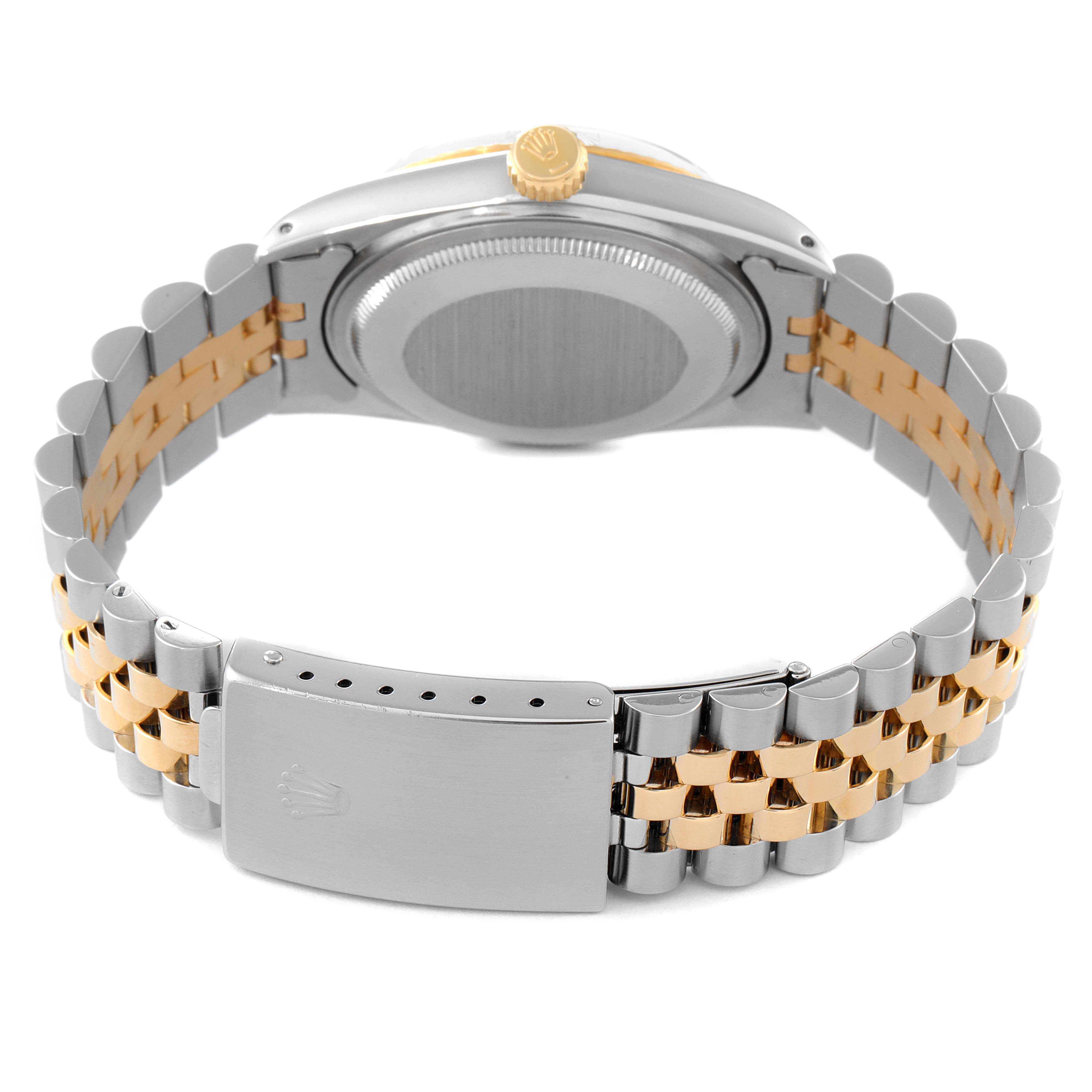 The image shows the back of a Rolex Datejust 16013 Men's Steel and Gold (two tone) Champagne Dial 16013 Men's Steel and Gold (two tone) Champagne Dial watch, highlighting its two-tone bracelet and clasp.