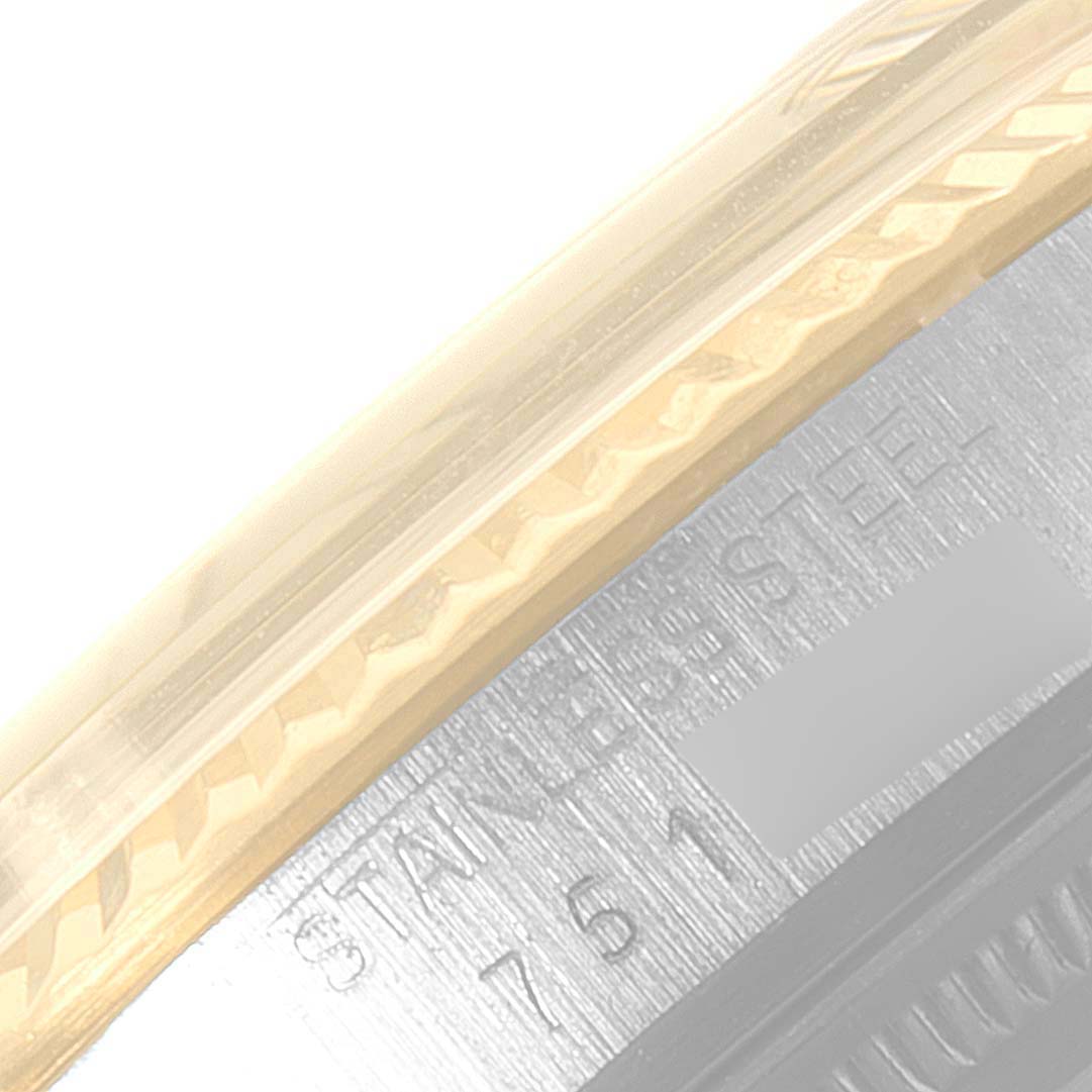 The image shows a close-up of the side view of a Rolex Datejust 16013 Men's Steel and Gold (two tone) Champagne Dial 16013 Men's Steel and Gold (two tone) Champagne Dial model, highlighting part of the bezel and case with the serial number.