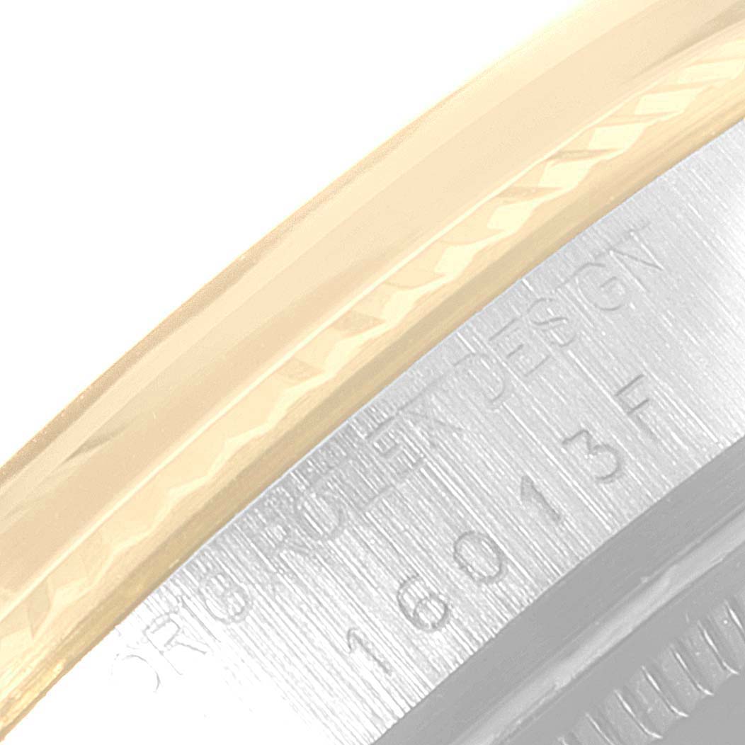 This image shows a close-up of the bezel and the side engraving of a Rolex Datejust 16013 Men's Steel and Gold (two tone) Champagne Dial 16013 Men's Steel and Gold (two tone) Champagne Dial watch.