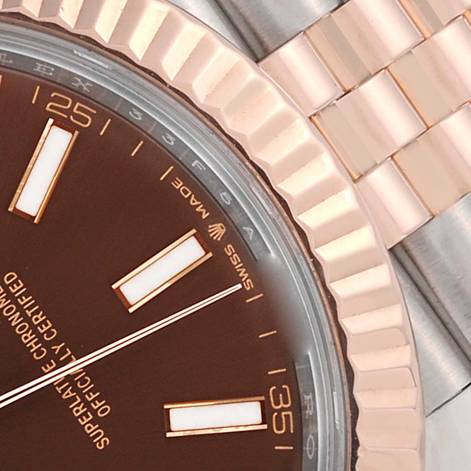 This close-up image shows the dial, bezel, and part of the bracelet of the Rolex Datejust 41 126331 Men's Steel and Gold (two tone) Brown Dial 126331 Men's Steel and Gold (two tone) Brown Dial model.