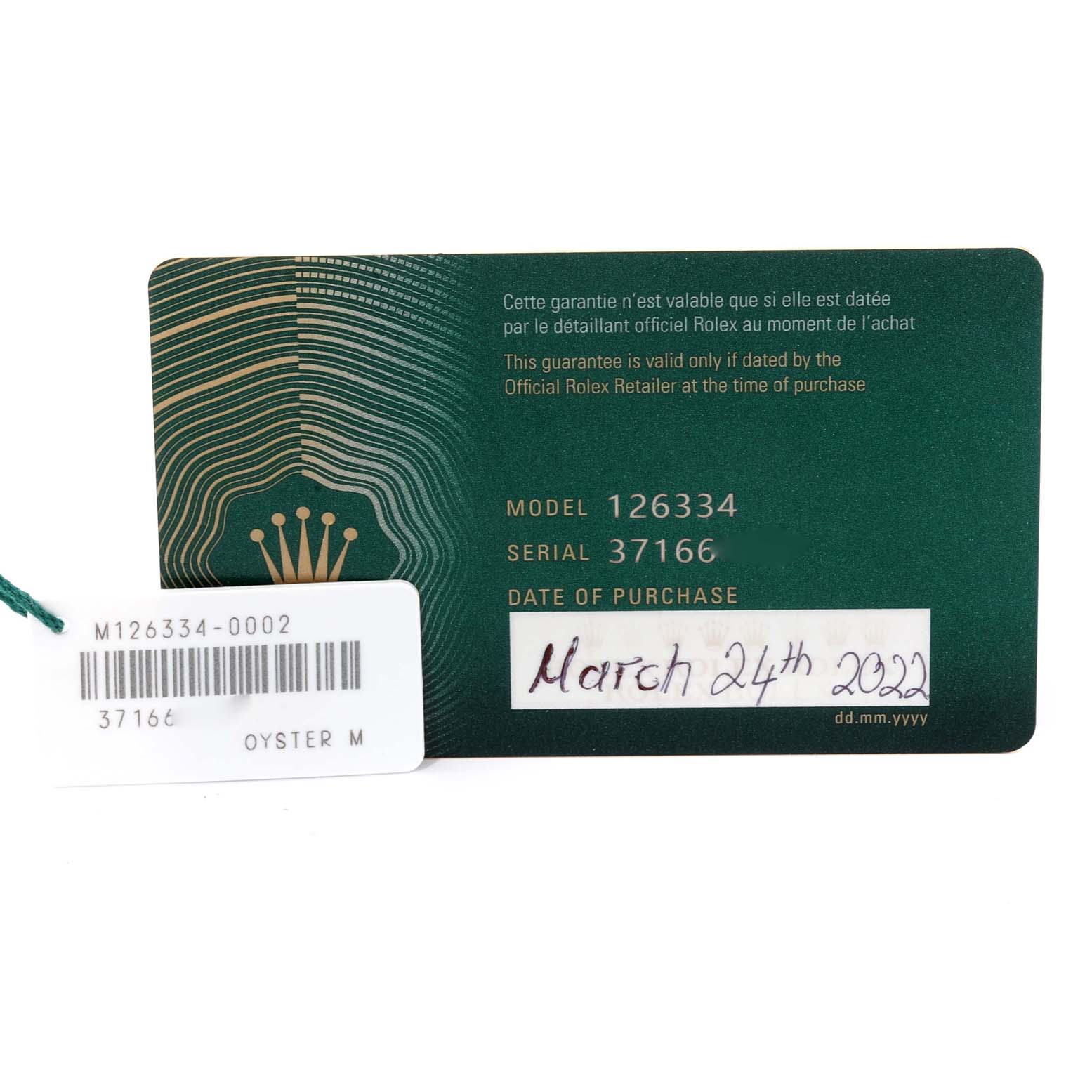 The image shows a Rolex Datejust 41 126334 Men
s Stainless Steel Blue Dial 126334 Men
s Stainless Steel Blue Dial warranty card with the model number, serial number, and date of purchase.