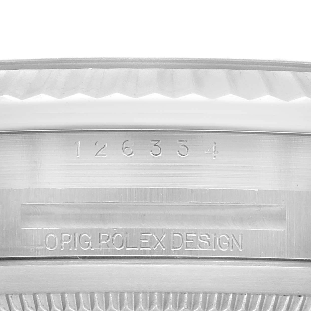 This image shows a close-up of the serial number and "Orig. Rolex Design" engraving on the back of the Rolex Datejust 41 126334 Men
s Stainless Steel Blue Dial 126334 Men
s Stainless Steel Blue Dial case.