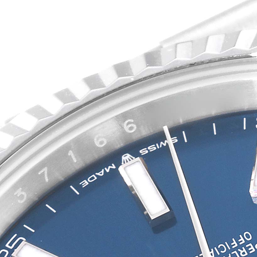 This close-up shot of the Rolex Datejust 41 126334 Men
s Stainless Steel Blue Dial 126334 Men
s Stainless Steel Blue Dial model shows part of the bezel, the hour markers, and the dial.