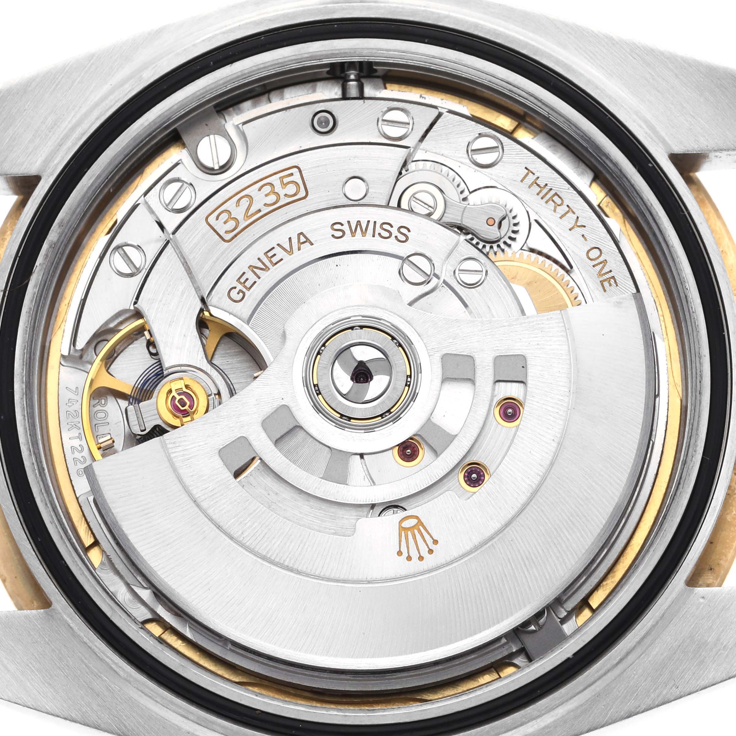 This is a close-up of the Rolex Datejust 41 126333 Men's Steel and Gold (two tone) Champagne Dial 126333 Men's Steel and Gold (two tone) Champagne Dial's movement, showcasing intricate inner mechanical parts and the rotor.