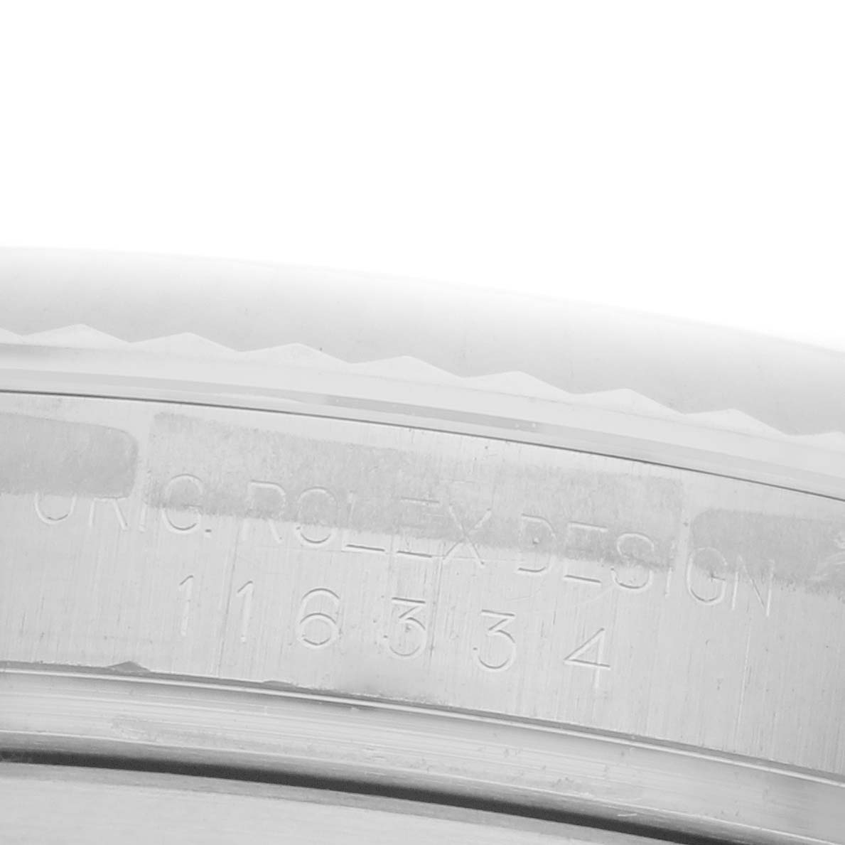 The image shows a close-up of the side engraving on the Rolex Datejust 41 116334 Men
s Stainless Steel Silver Dial 116334 Men
s Stainless Steel Silver Dial, highlighting the model number and design text.