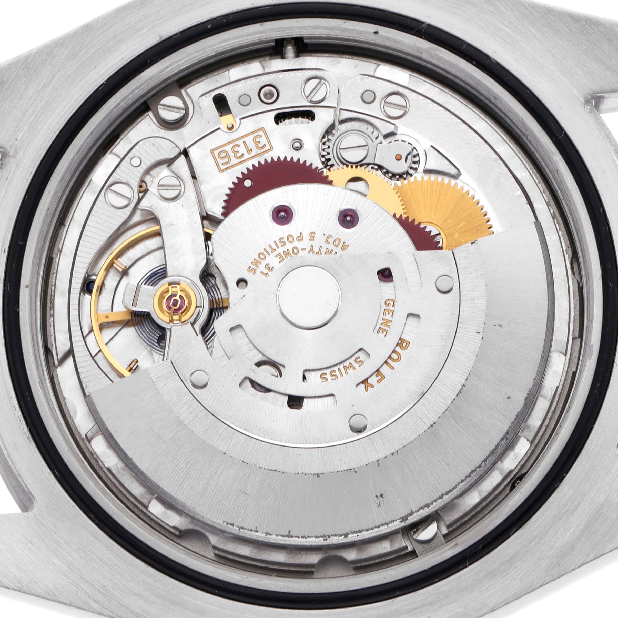 The image shows the movement of a Rolex Datejust 41 116334 Men
s Stainless Steel Silver Dial 116334 Men
s Stainless Steel Silver Dial, focusing on its intricate gears and rotor mechanism.