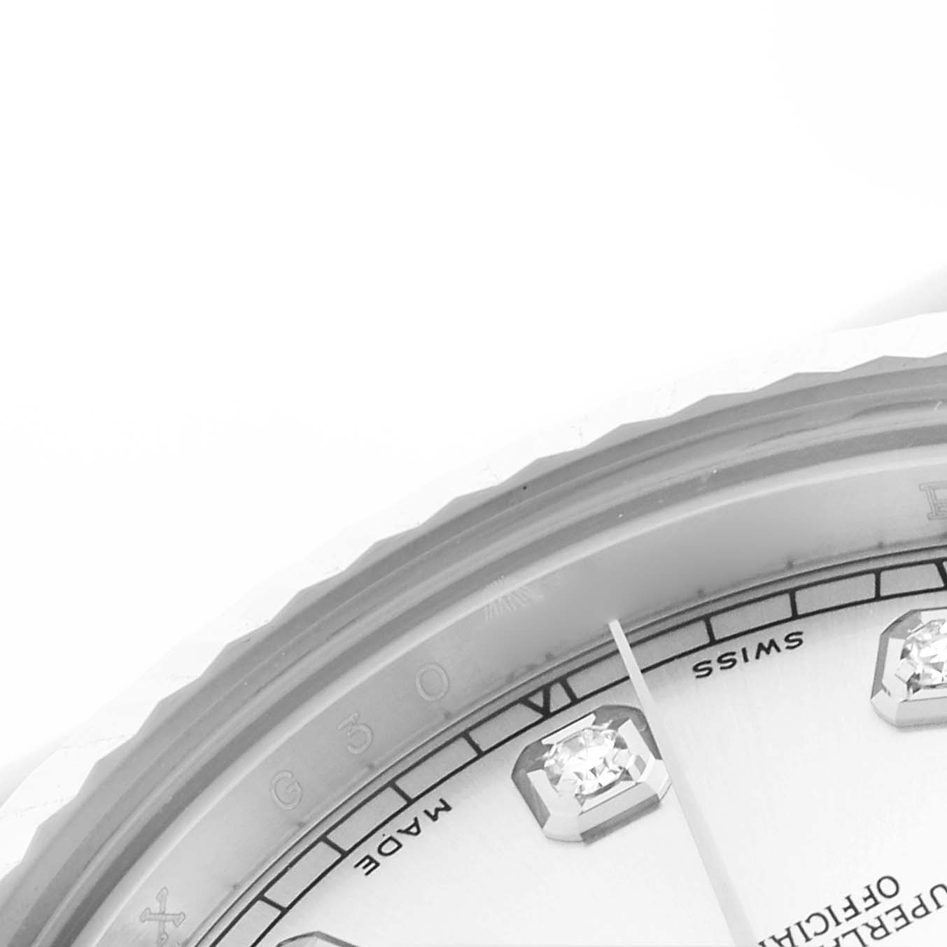 The image shows a close-up of the Rolex Datejust 41 116334 Men
s Stainless Steel Silver Dial 116334 Men
s Stainless Steel Silver Dial
s dial and bezel, highlighting diamond hour markers and part of the minute hand.