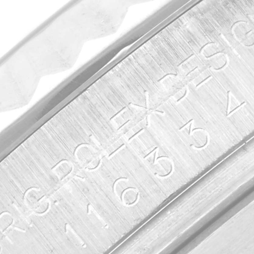 This close-up image shows the engraving on the case of a Rolex Datejust 41 116334 Men
s Stainless Steel Grey Dial 116334 Men
s Stainless Steel Grey Dial watch, focusing on the model and serial number.
