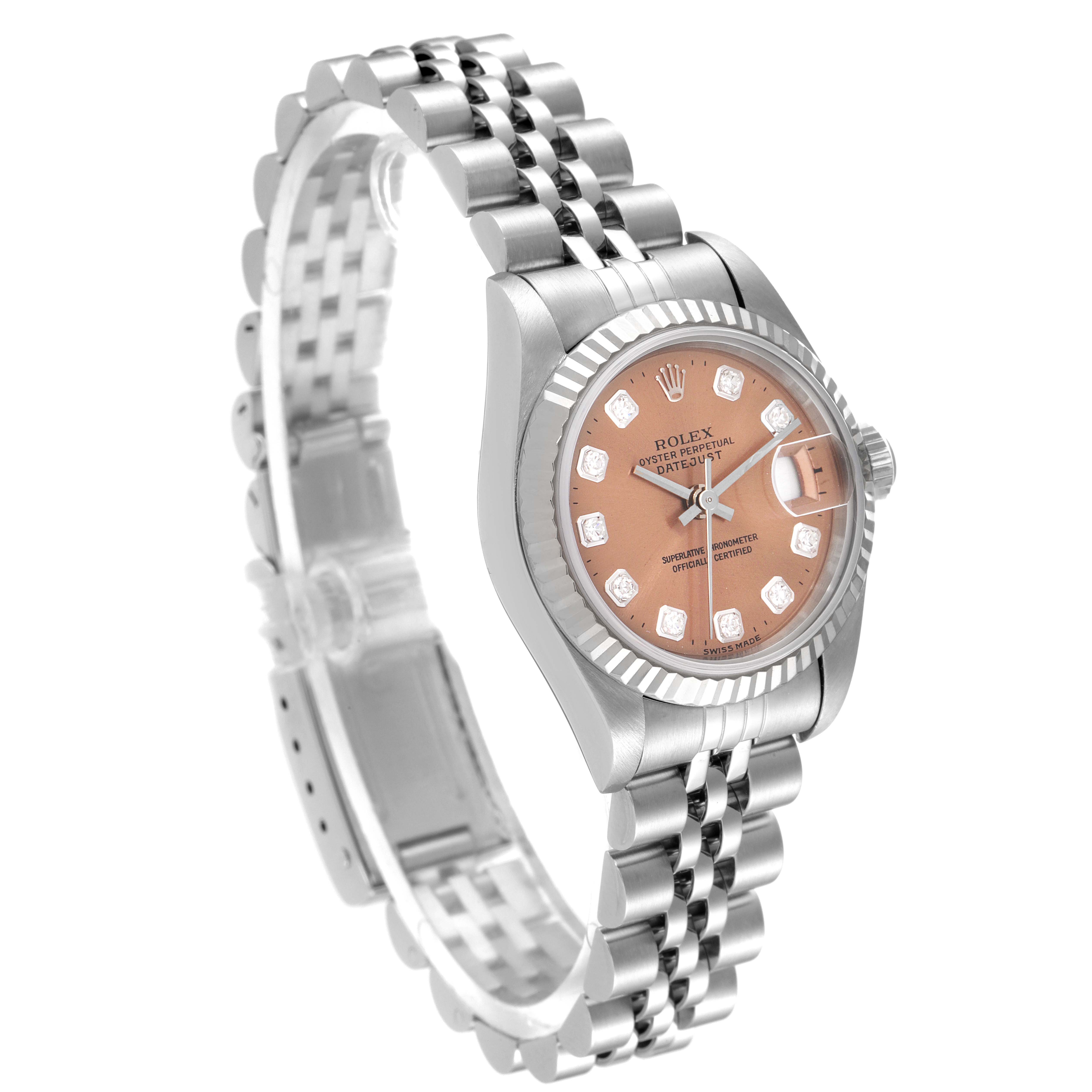 The Rolex Datejust 69174 Women's Stainless Steel Pink Dial 69174 Women's Stainless Steel Pink Dial watch is shown from an angled side view, displaying the face, bracelet, and crown.