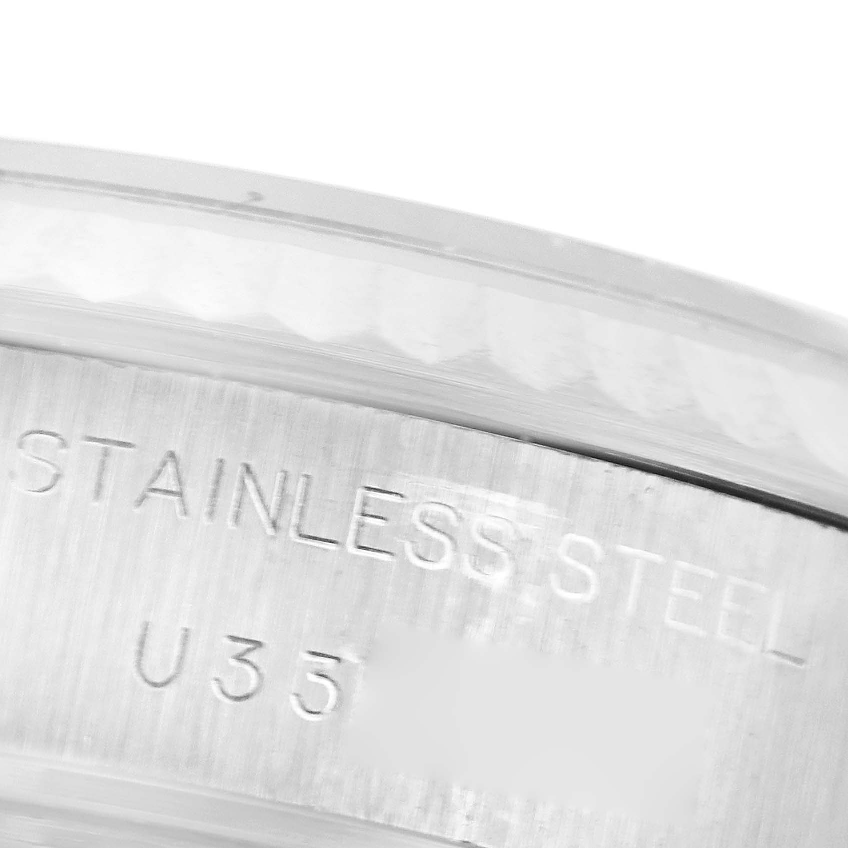 The image shows a close-up of the stainless steel case back with engraved text from the Rolex Datejust 69174 Women's Stainless Steel Pink Dial 69174 Women's Stainless Steel Pink Dial model.