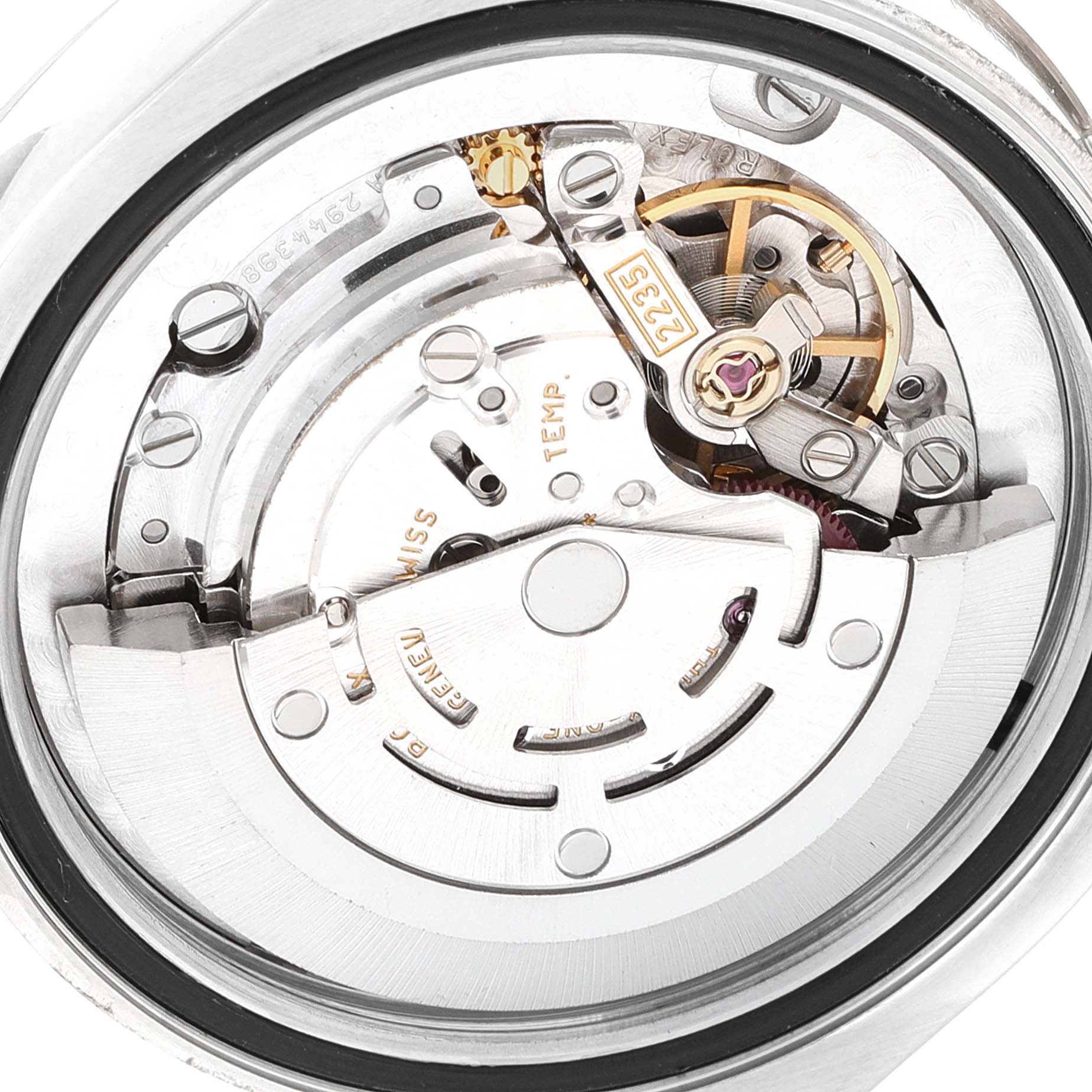 The image shows the internal mechanism of a mid-size Rolex watch, viewed from the back.