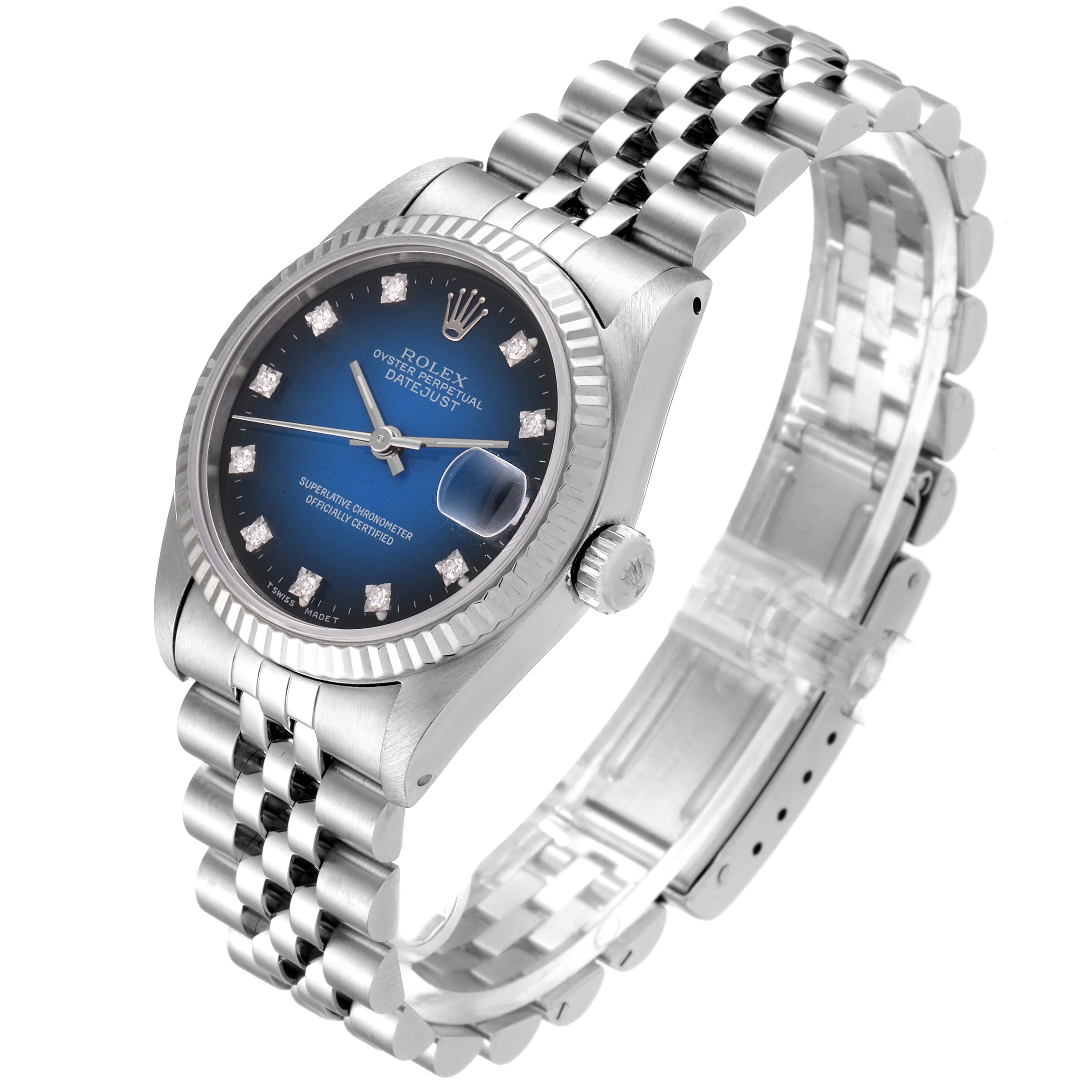 The image shows a Rolex Mid-Size 68274 Women's Stainless Steel Blue Dial 68274 Women's Stainless Steel Blue Dial Datejust watch at a three-quarter angle, highlighting its blue dial, fluted bezel, and jubilee bracelet.