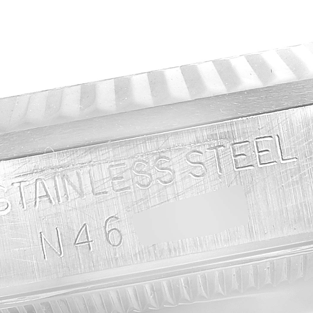This image shows a close-up of the case side and bezel of a Mid-Size Rolex watch, highlighting its stainless steel part.