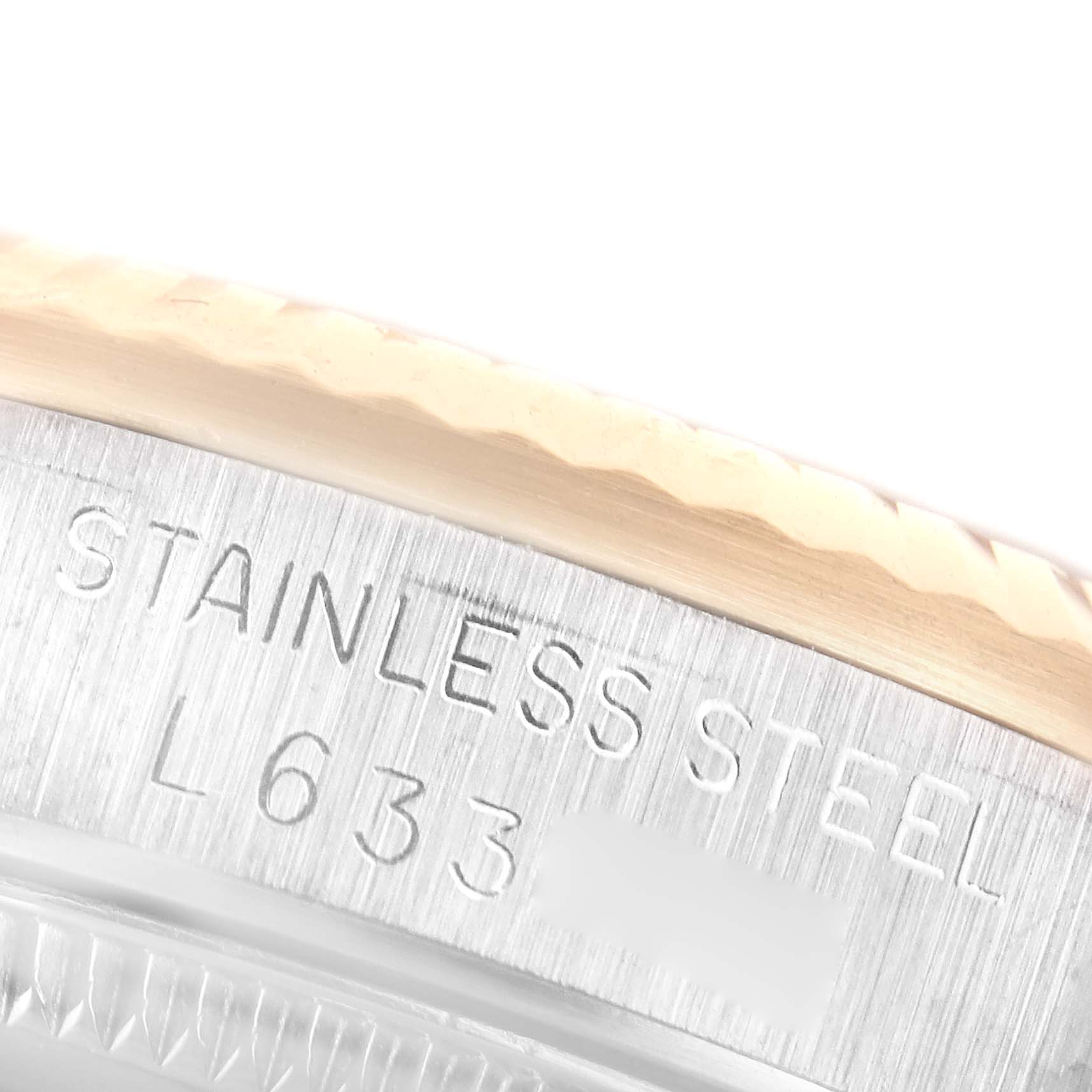 Close-up view of the case back and outer edge of a stainless steel Rolex Mid-Size 68273 Women
s Steel and Gold (two tone) White Dial 68273 Women
s Steel and Gold (two tone) White Dial watch, showing part of the engravings.