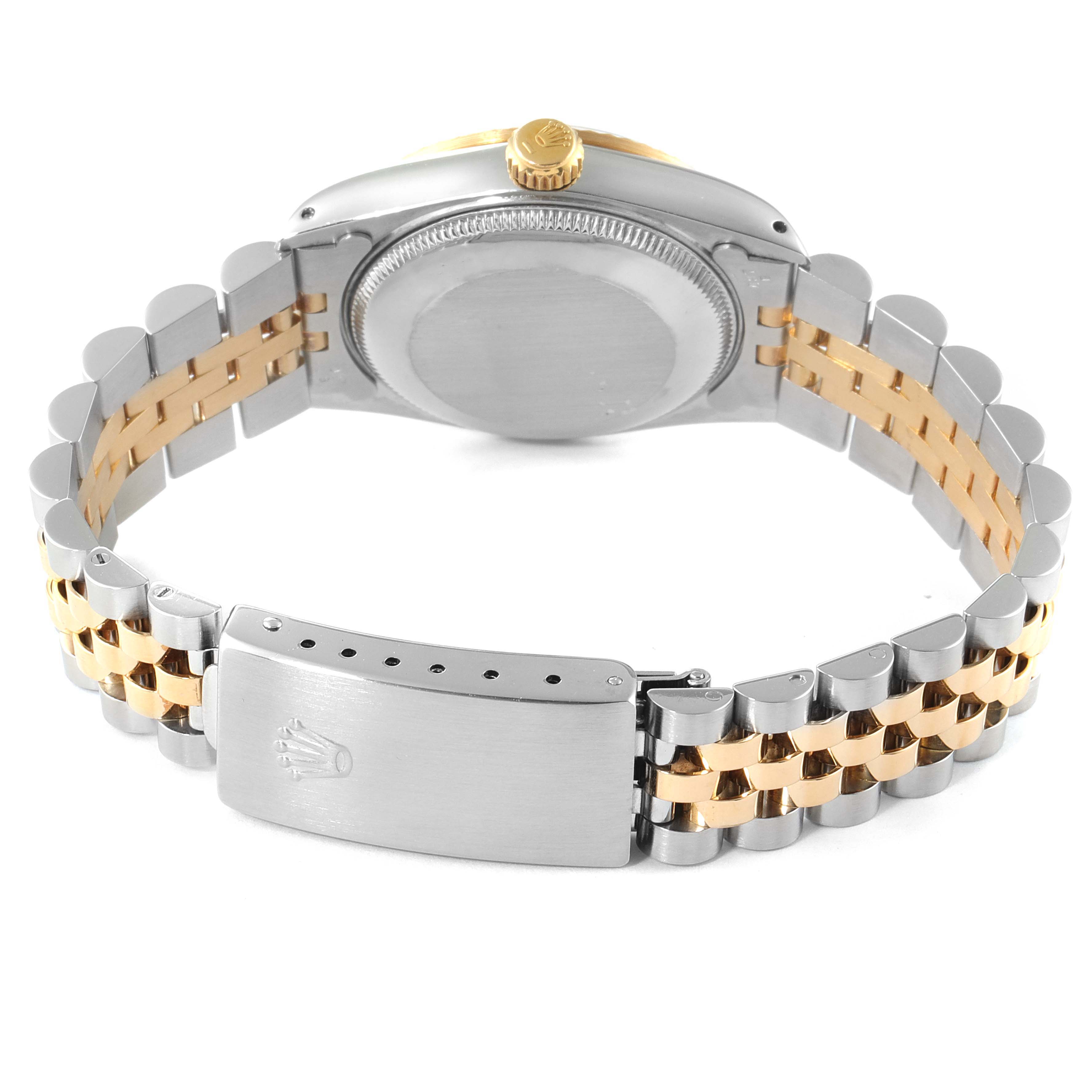 The image shows the back of a Rolex Mid-Size 68273 Women
s Steel and Gold (two tone) White Dial 68273 Women
s Steel and Gold (two tone) White Dial watch, highlighting its case back, crown, and two-tone bracelet with clasp.