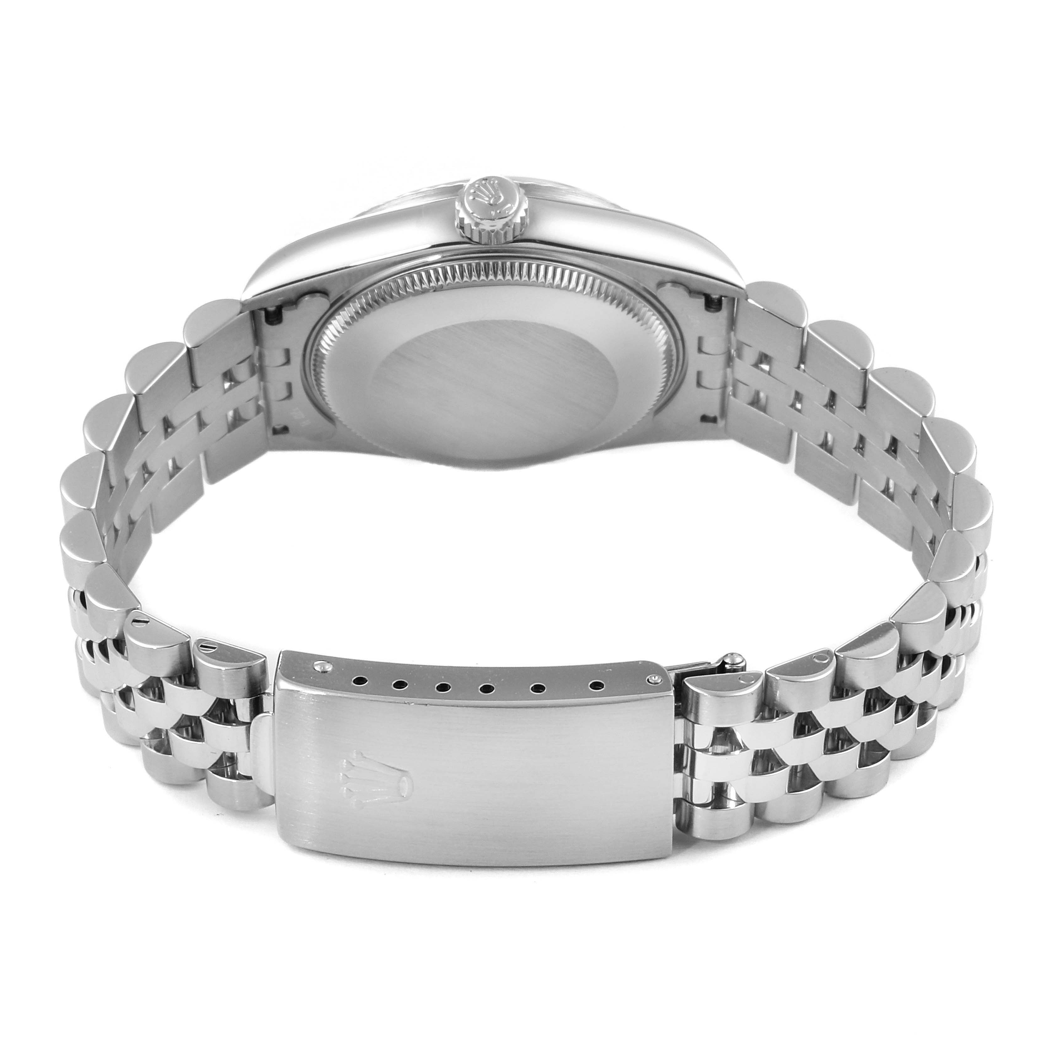 The image shows the back view of a Rolex Datejust 78274 Women's Stainless Steel Black Dial 78274 Women's Stainless Steel Black Dial watch, highlighting its bracelet and clasp.