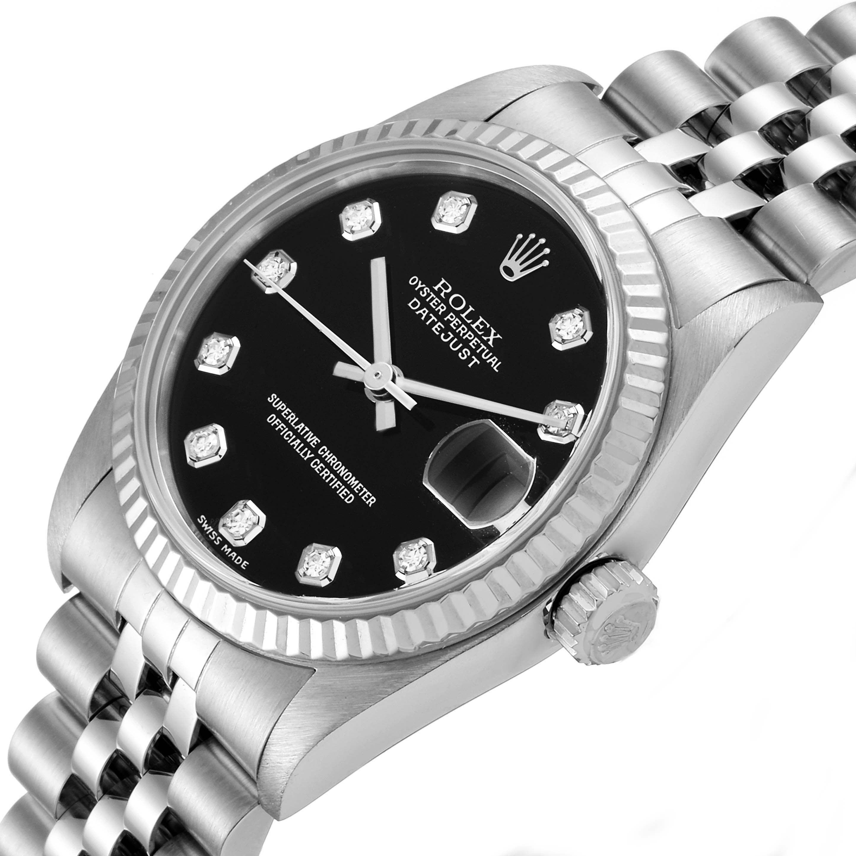 This image shows a Rolex Datejust 78274 Women's Stainless Steel Black Dial 78274 Women's Stainless Steel Black Dial watch from an angle featuring its face, bezel, crown, and part of the bracelet.