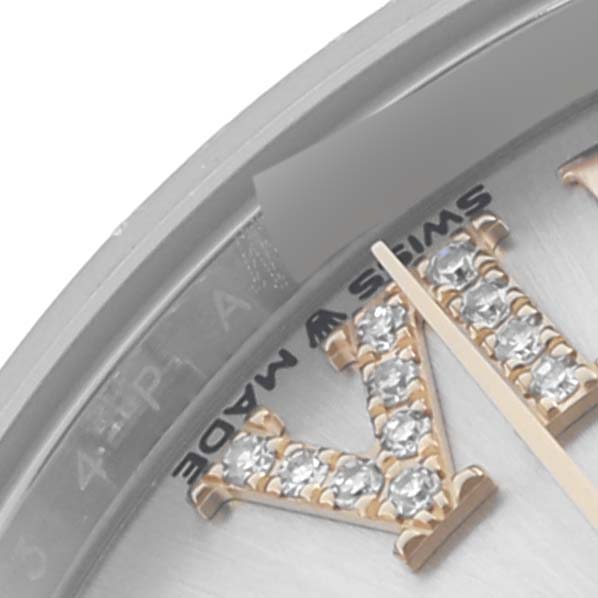 The image shows a close-up of the dial and bezel of a Rolex Datejust 278243 Women's Steel and Gold (two tone) Silver Dial 278243 Women's Steel and Gold (two tone) Silver Dial, highlighting the jeweled Roman numerals and part of the Swiss Made label.
