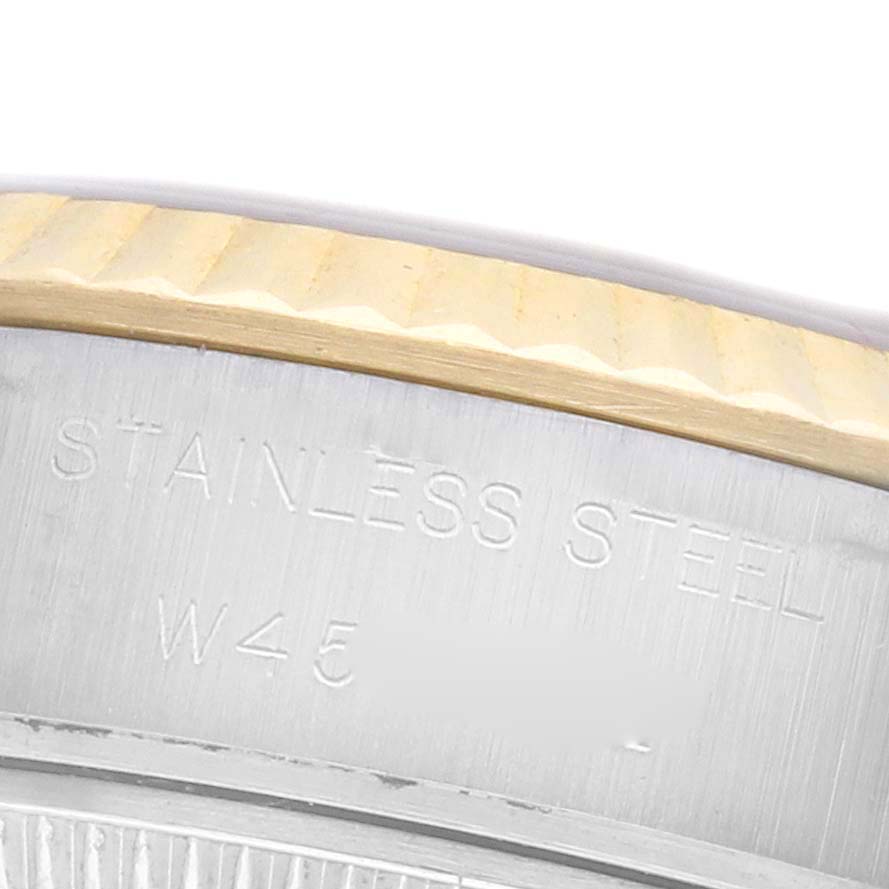 The image shows a close-up of the side of a Rolex Datejust 69173 Women's Steel and Gold (two tone) Silver Dial 69173 Women's Steel and Gold (two tone) Silver Dial, highlighting the stainless steel part with engravings.