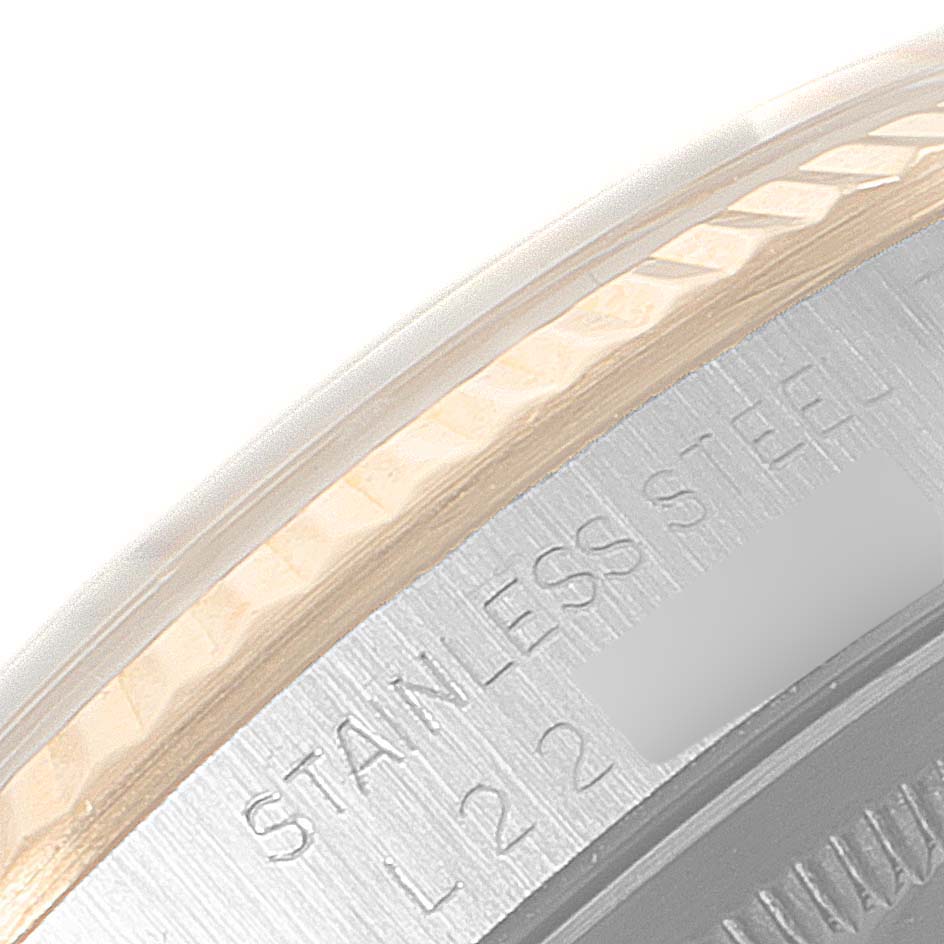 The image shows a close-up of the bezel and edge of the case back with "STAINLESS STEEL" engraved on a Rolex Datejust 16233 Men's Steel and Gold (two tone) Champagne Dial 16233 Men's Steel and Gold (two tone) Champagne Dial watch.