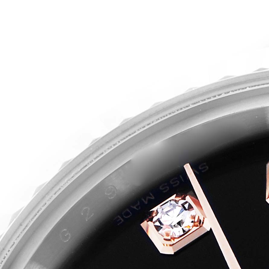 The image shows a close-up of the Rolex Datejust 179171 Women's Steel and Gold (two tone) Black Dial 179171 Women's Steel and Gold (two tone) Black Dial watch face, highlighting a diamond hour marker and part of the bezel.