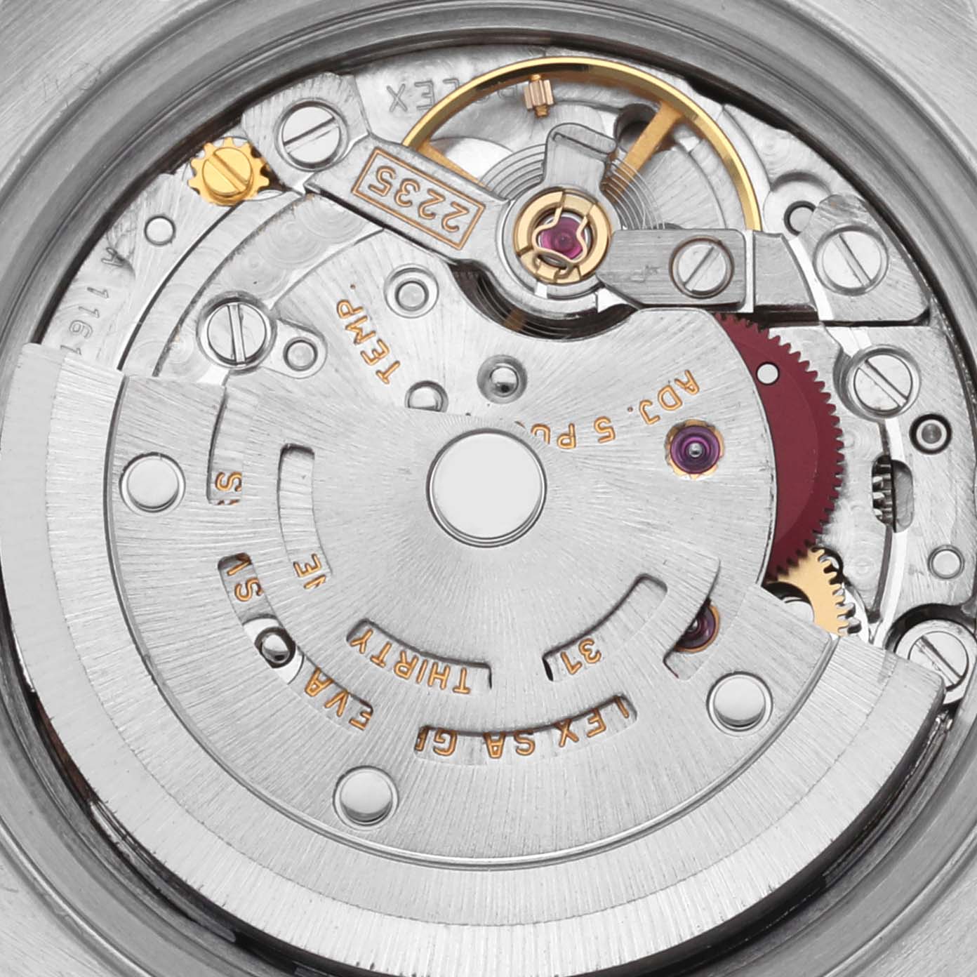 The image shows the movement mechanism of a Rolex Datejust 79174NRD Women's Stainless Steel Mother of Pearl Dial 79174NRD Women's Stainless Steel Mother of Pearl Dial, viewed from above, highlighting gears and the rotor.