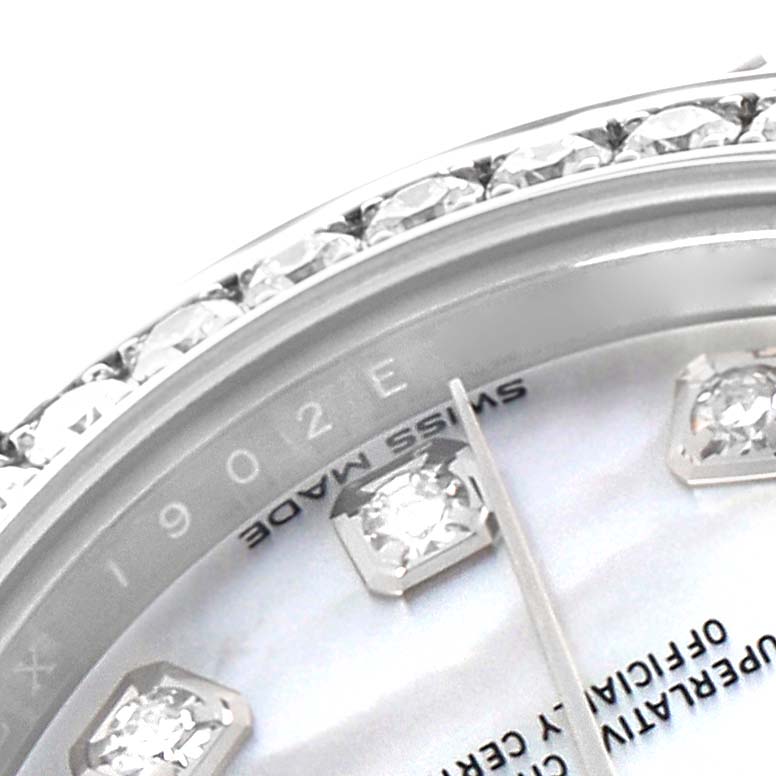 The image shows a close-up of the Rolex Datejust 279384 Women's Stainless Steel Mother of Pearl Dial 279384 Women's Stainless Steel Mother of Pearl Dial model's bezel with diamonds and part of the dial with diamond markers.