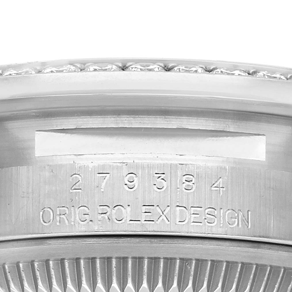 The image shows a close-up of the side engraving on the case of a Rolex Datejust 279384 Women's Stainless Steel Mother of Pearl Dial 279384 Women's Stainless Steel Mother of Pearl Dial watch.