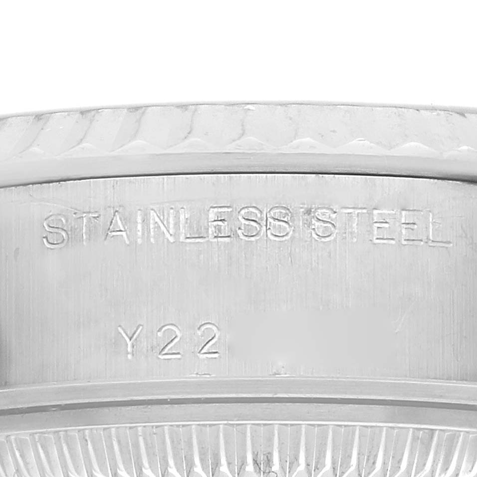 The image shows a close-up of the side of a Rolex Datejust 79174 Women's Stainless Steel Silver Dial 79174 Women's Stainless Steel Silver Dial watch case, highlighting the "STAINLESS STEEL" engraving.