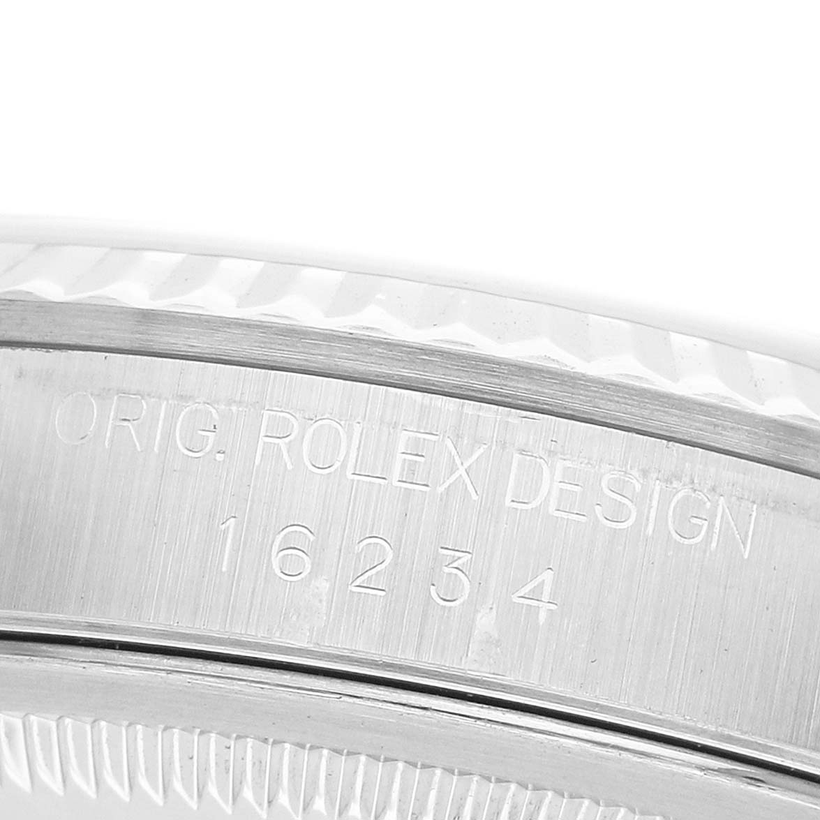 The image shows a close-up of the case side of a Rolex Datejust 16234 Men's Stainless Steel Silver Dial, highlighting the engraved serial and model numbers.