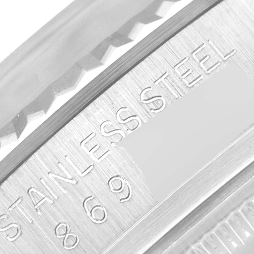 This is a close-up of the bezel and case of the Rolex Vintage Collection 16014 Men's Stainless Steel Silver Dial 16014 Men's Stainless Steel Silver Dial watch, showing the "STAINLESS STEEL" engraving.