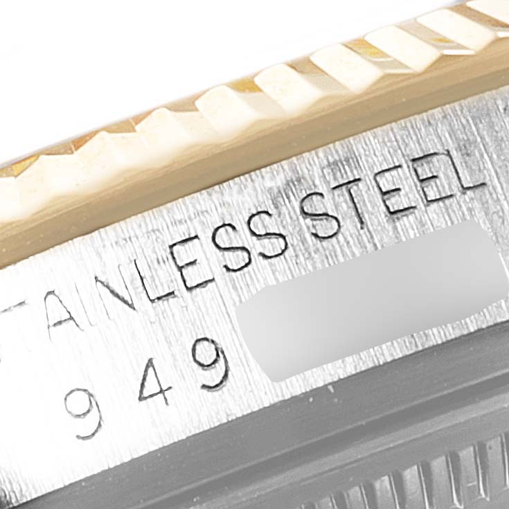 This image shows a close-up of the stainless steel case and fluted bezel of a Rolex Vintage Collection 16013 Men's Steel and Gold (two tone) Champagne Dial 16013 Men's Steel and Gold (two tone) Champagne Dial model.