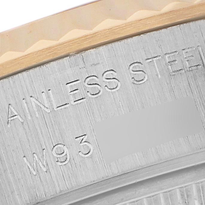 The image shows a close-up of the engraved text on the side of a Rolex Datejust 69173 Women's Steel and Gold (two tone) Champagne Dial 69173 Women's Steel and Gold (two tone) Champagne Dial watch, highlighting "STAINLESS STEEL."