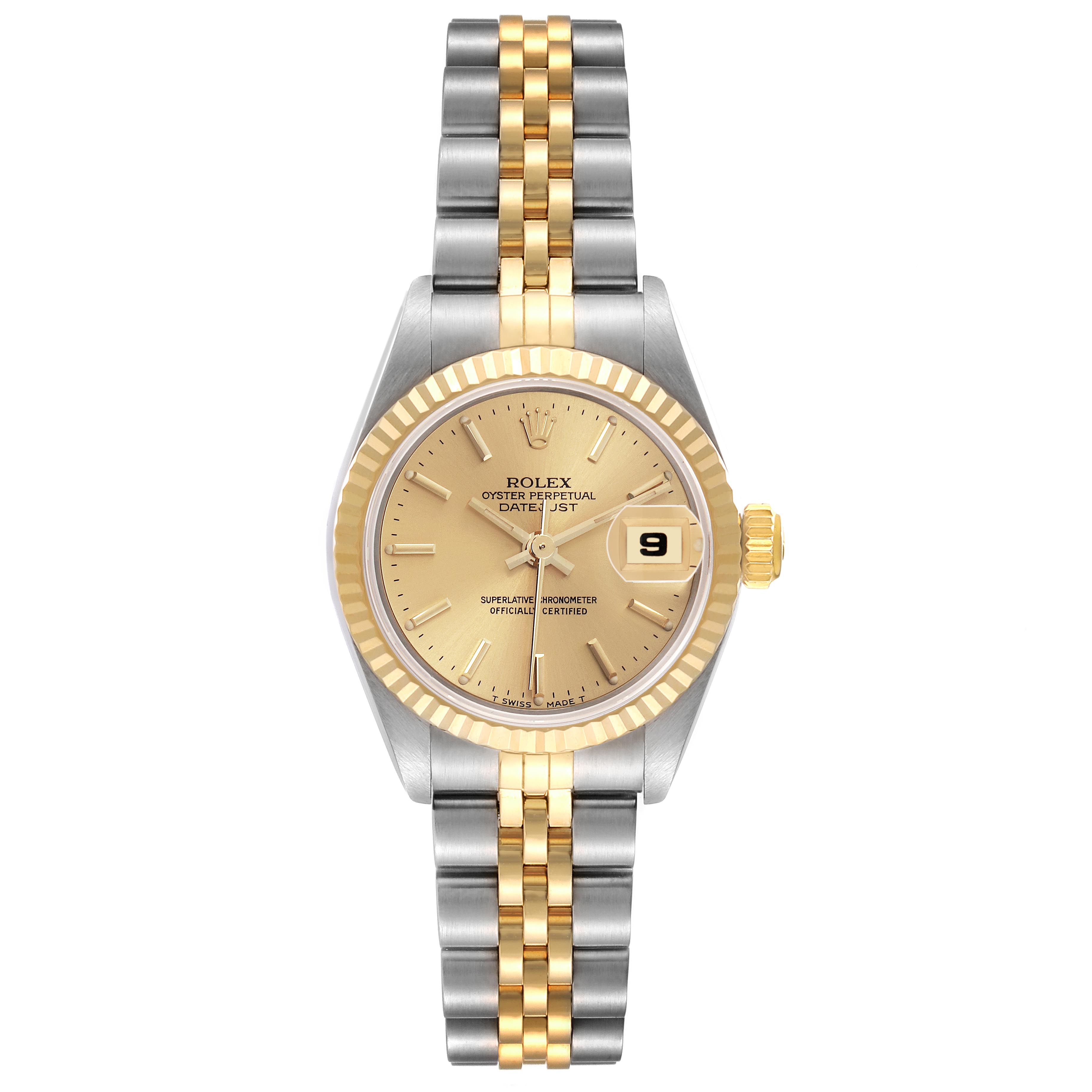 The Rolex Datejust 69173 Women's Steel and Gold (two tone) Champagne Dial 69173 Women's Steel and Gold (two tone) Champagne Dial is shown in a top-down angle, featuring a gold and silver jubilee bracelet and a fluted bezel.