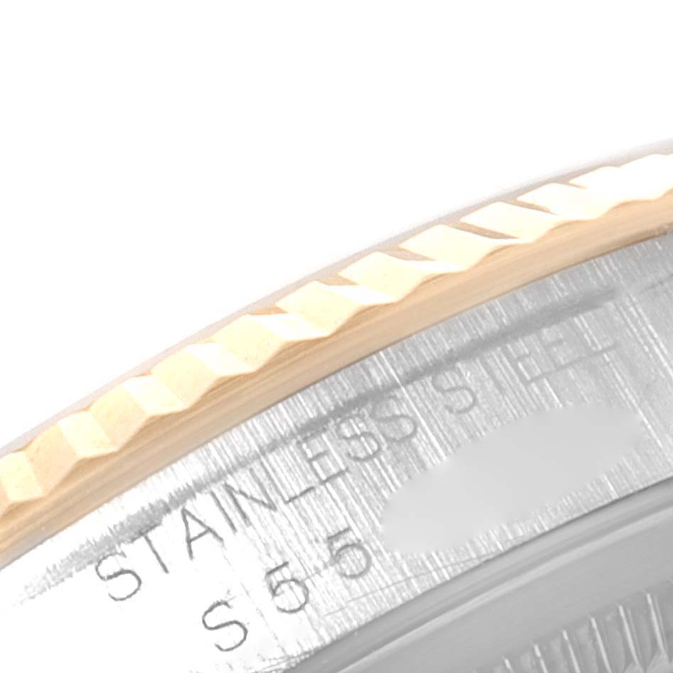 This image shows a close-up of the bezel and stainless steel case of a Rolex Datejust 16233 Men's Steel and Gold (two tone) Champagne Dial 16233 Men's Steel and Gold (two tone) Champagne Dial watch.
