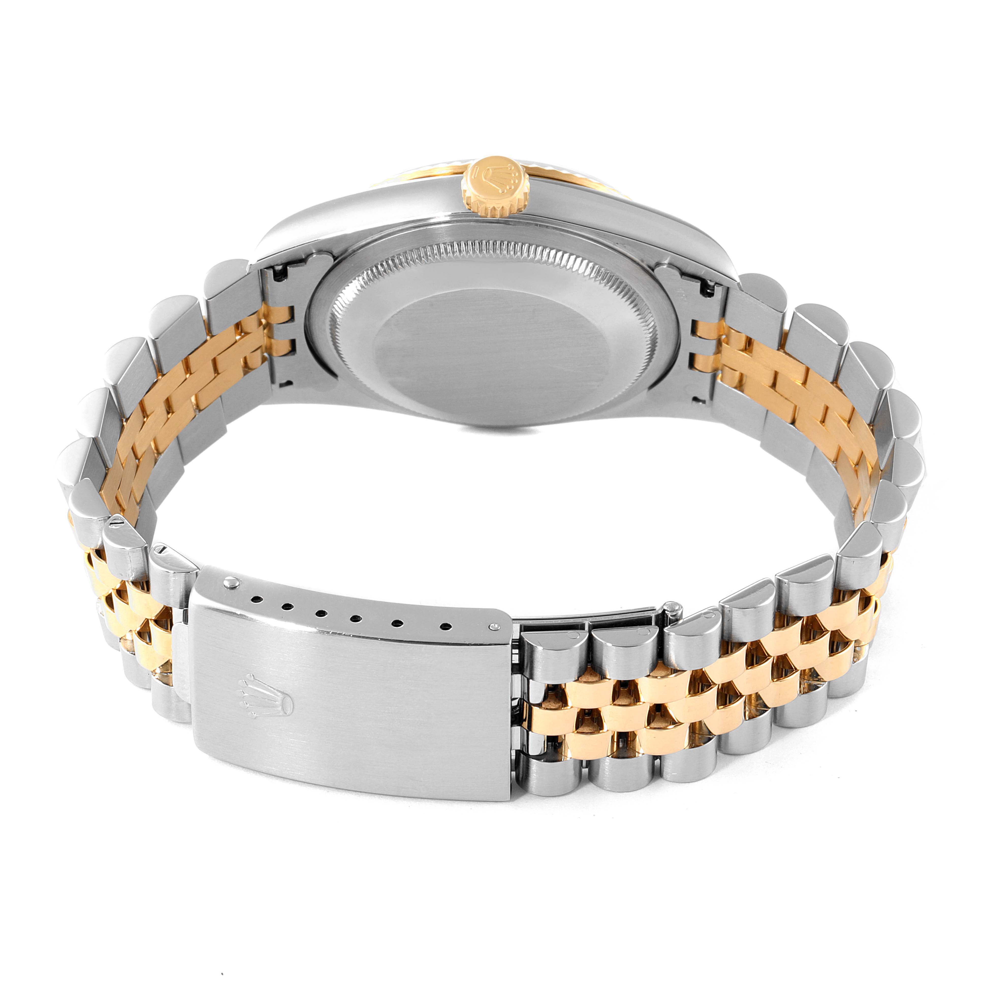 This image shows the back view of a Rolex Datejust 16233 Men's Steel and Gold (two tone) Champagne Dial 16233 Men's Steel and Gold (two tone) Champagne Dial watch focusing on its case, crown, and two-tone jubilee bracelet with a clasp.