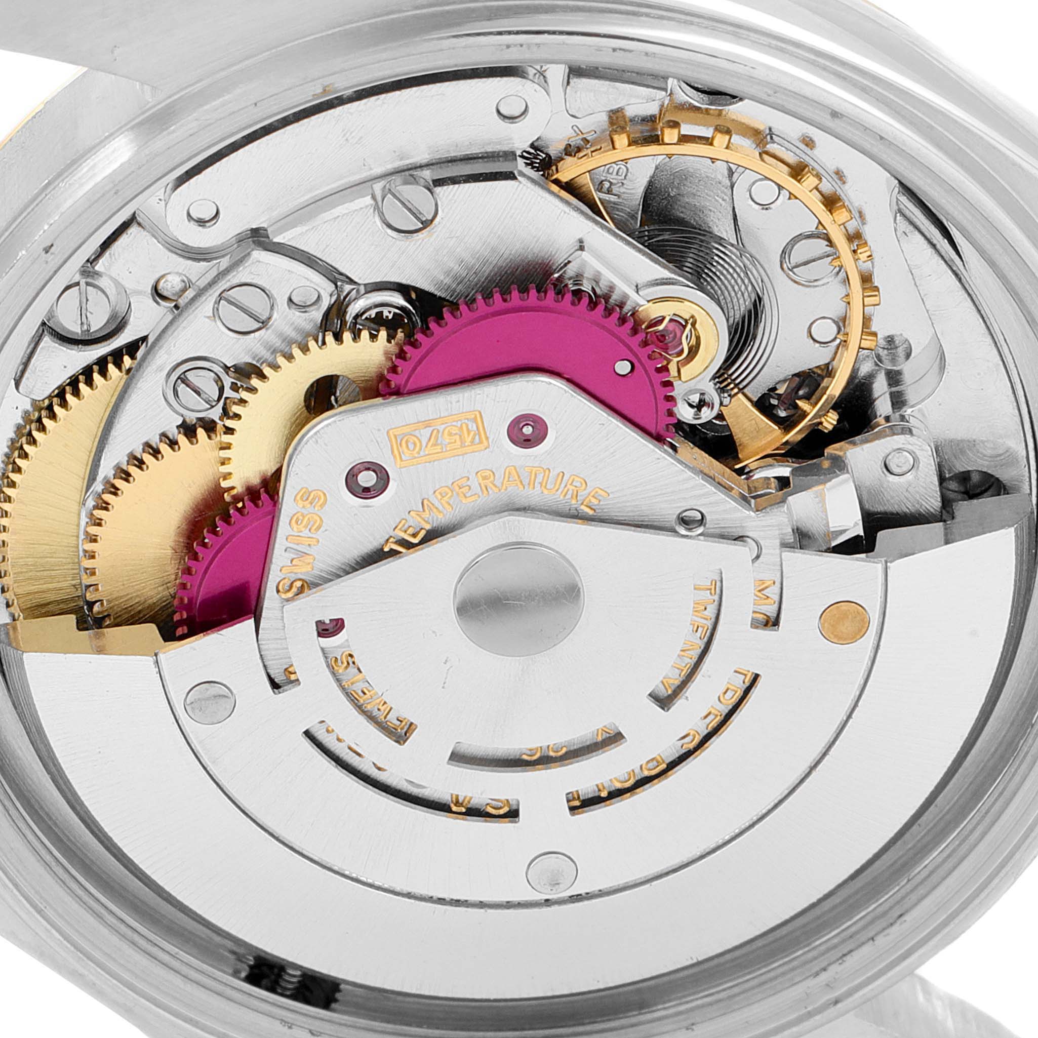 Close-up view of the internal movement components of a Rolex Vintage Collection 1601 Men's Steel and Gold (two tone) Silver Dial 1601 Men's Steel and Gold (two tone) Silver Dial watch, showing gears and intricate mechanisms.