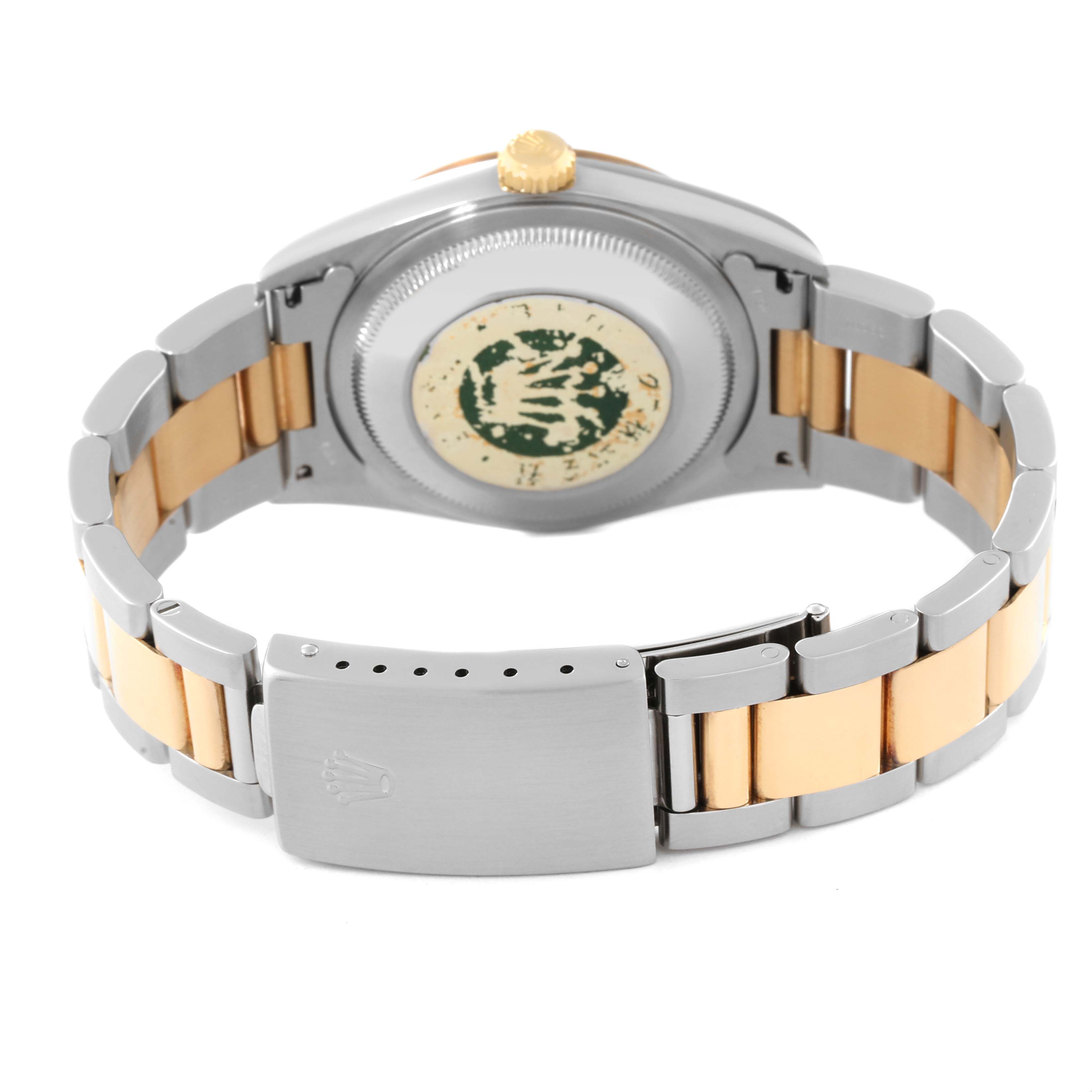 This image shows the back side of the Rolex Datejust 16203 Men's Steel and Gold (two tone) Grey Dial 16203 Men's Steel and Gold (two tone) Grey Dial with its two-tone bracelet and clasp.