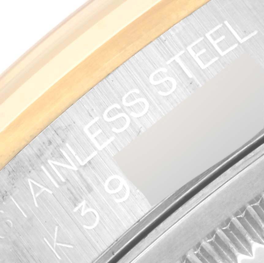 This image shows a close-up of the side of a Rolex Datejust 16203 Men's Steel and Gold (two tone) Grey Dial 16203 Men's Steel and Gold (two tone) Grey Dial watch, focusing on the engraved text on its stainless steel casing.