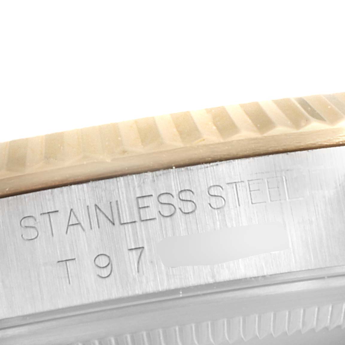 The image shows a close-up of the side detailing of a Rolex Datejust 16233 Men's Steel and Gold (two tone) Blue Dial 16233 Men's Steel and Gold (two tone) Blue Dial watch, highlighting the stainless steel material and fluted bezel.