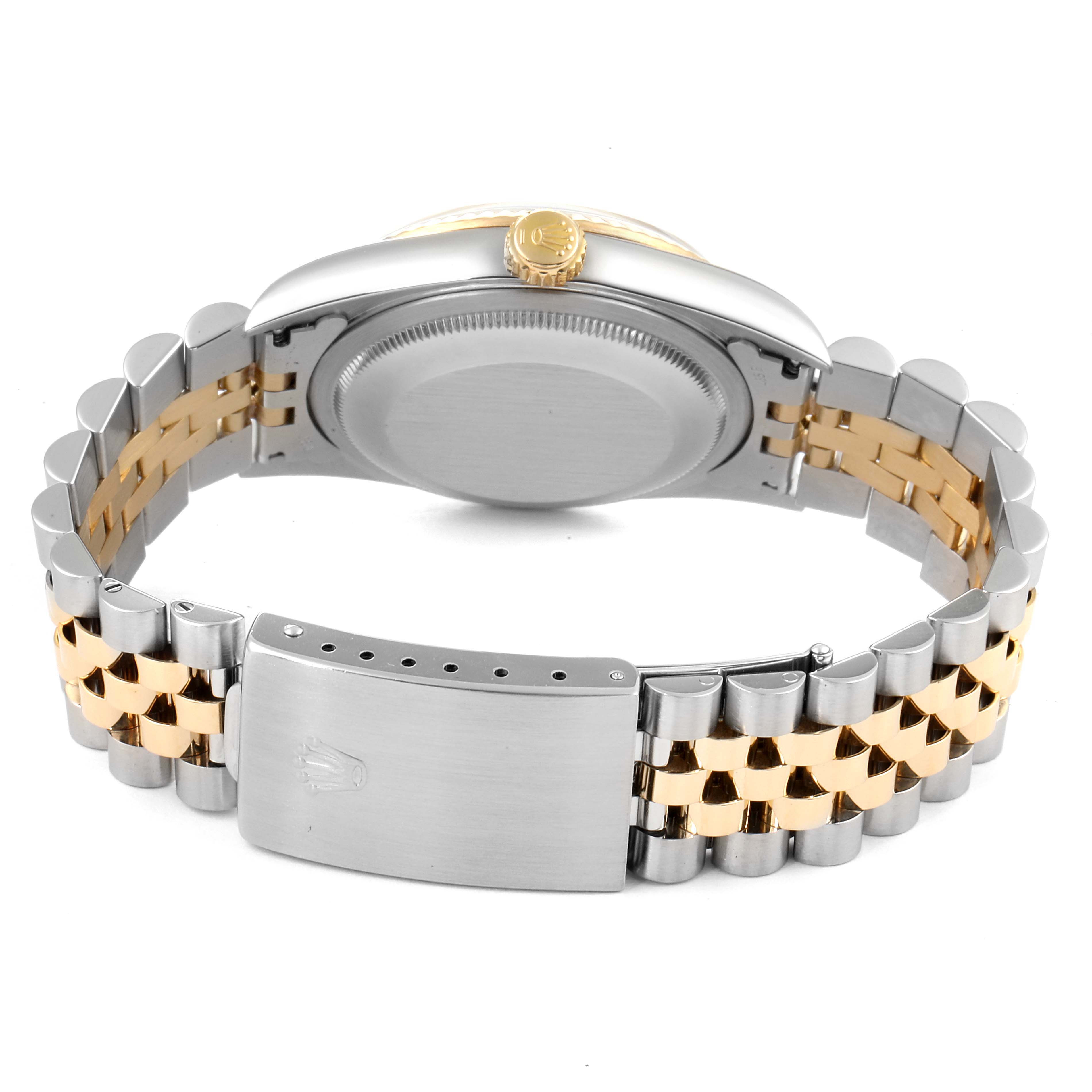 The image shows the back view of a Rolex Datejust 16233 Men's Steel and Gold (two tone) Blue Dial 16233 Men's Steel and Gold (two tone) Blue Dial watch, highlighting its case, crown, and two-tone jubilee bracelet and clasp.